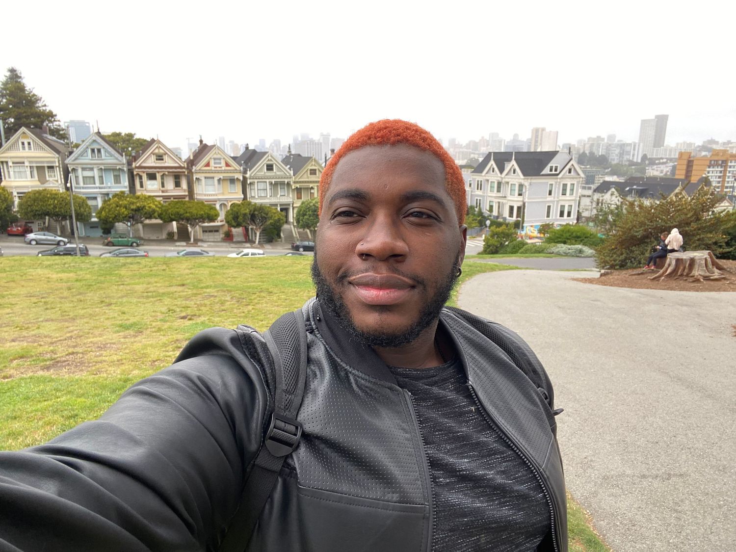 Selfie taken at Alamo Square Park in San Francisco with the famous Painted Ladies Victorian houses in the background.