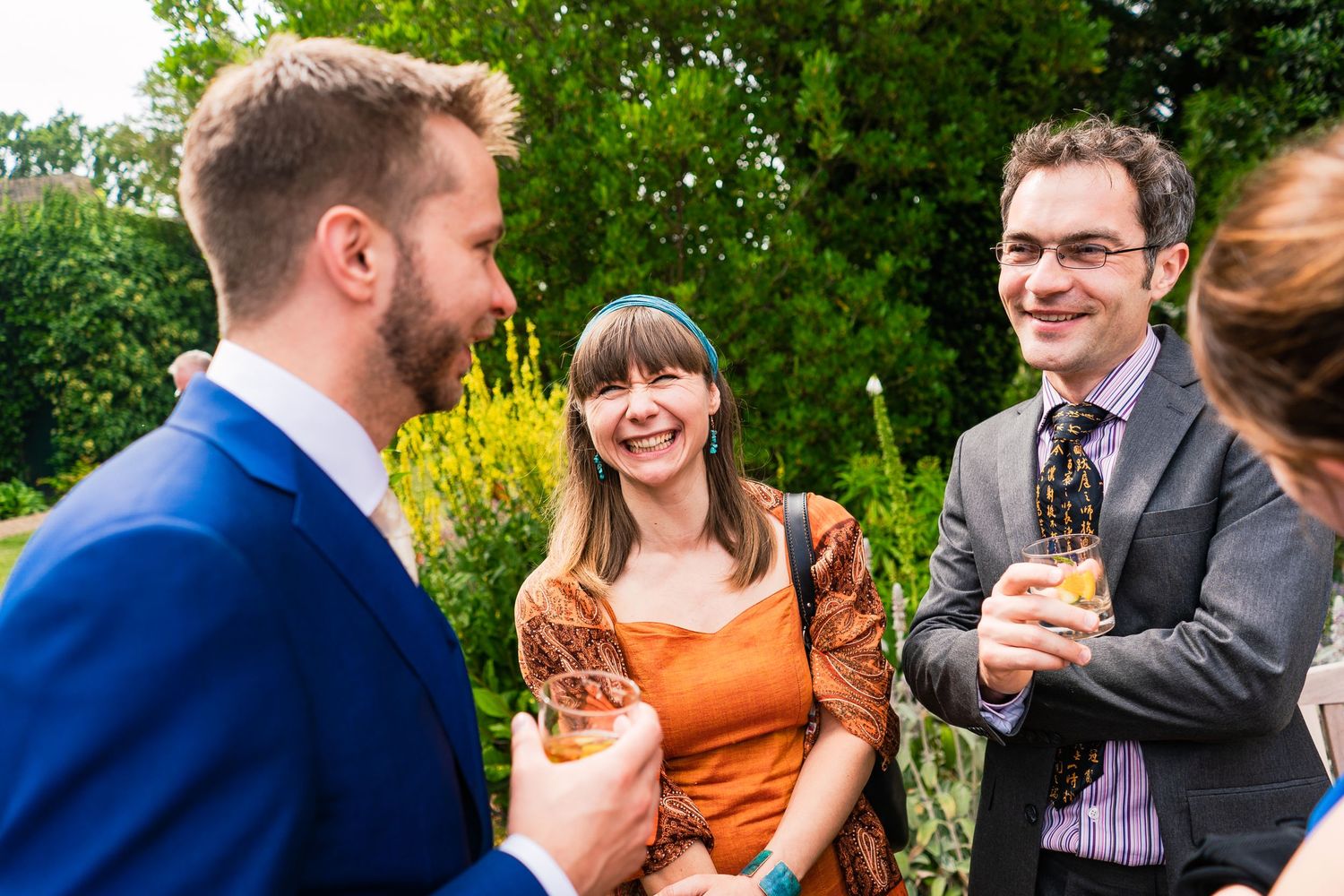 Wedding guests in Trinity College gardens, Cambridge