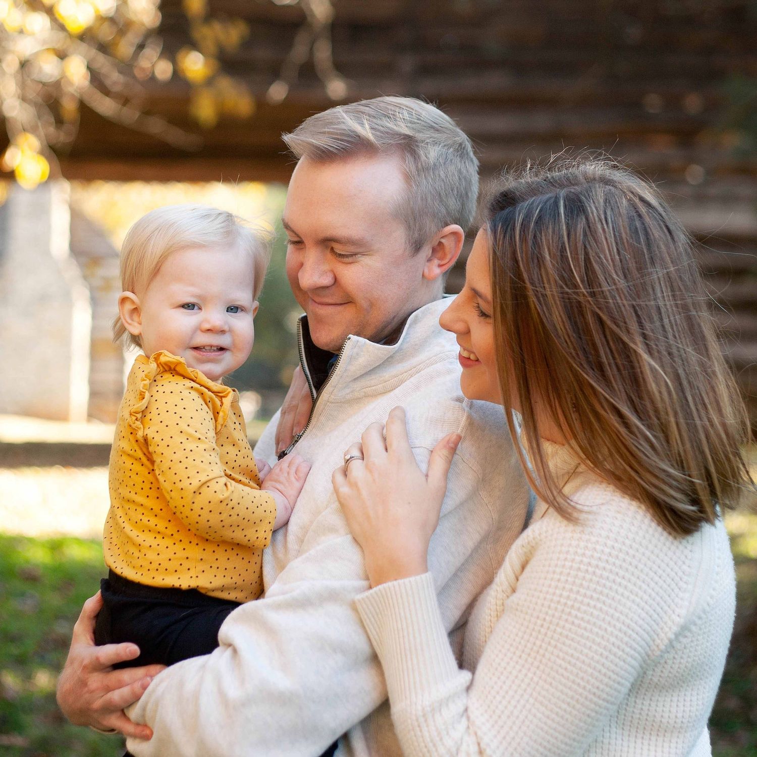 mom & dad smiling at baby by victoria leigh photography