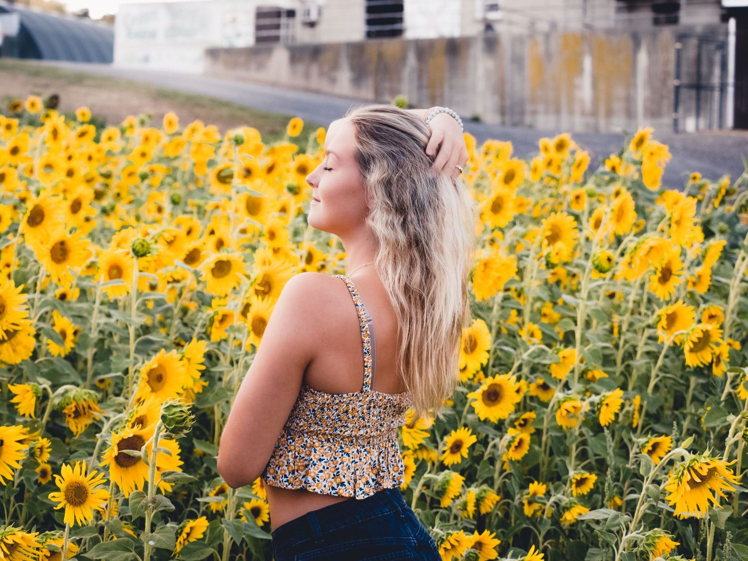Portrait and fine art photography of girl in sunflowers