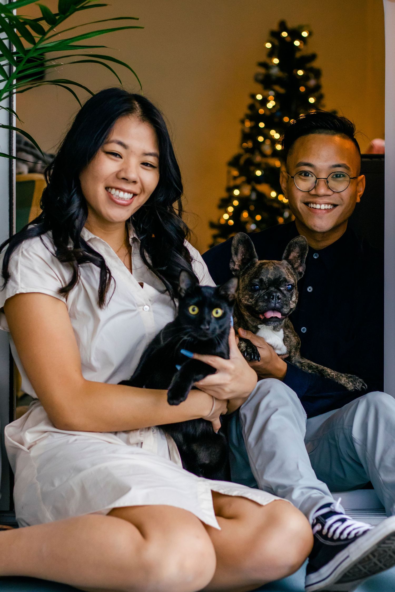 Asian couple with black cat & frenchie