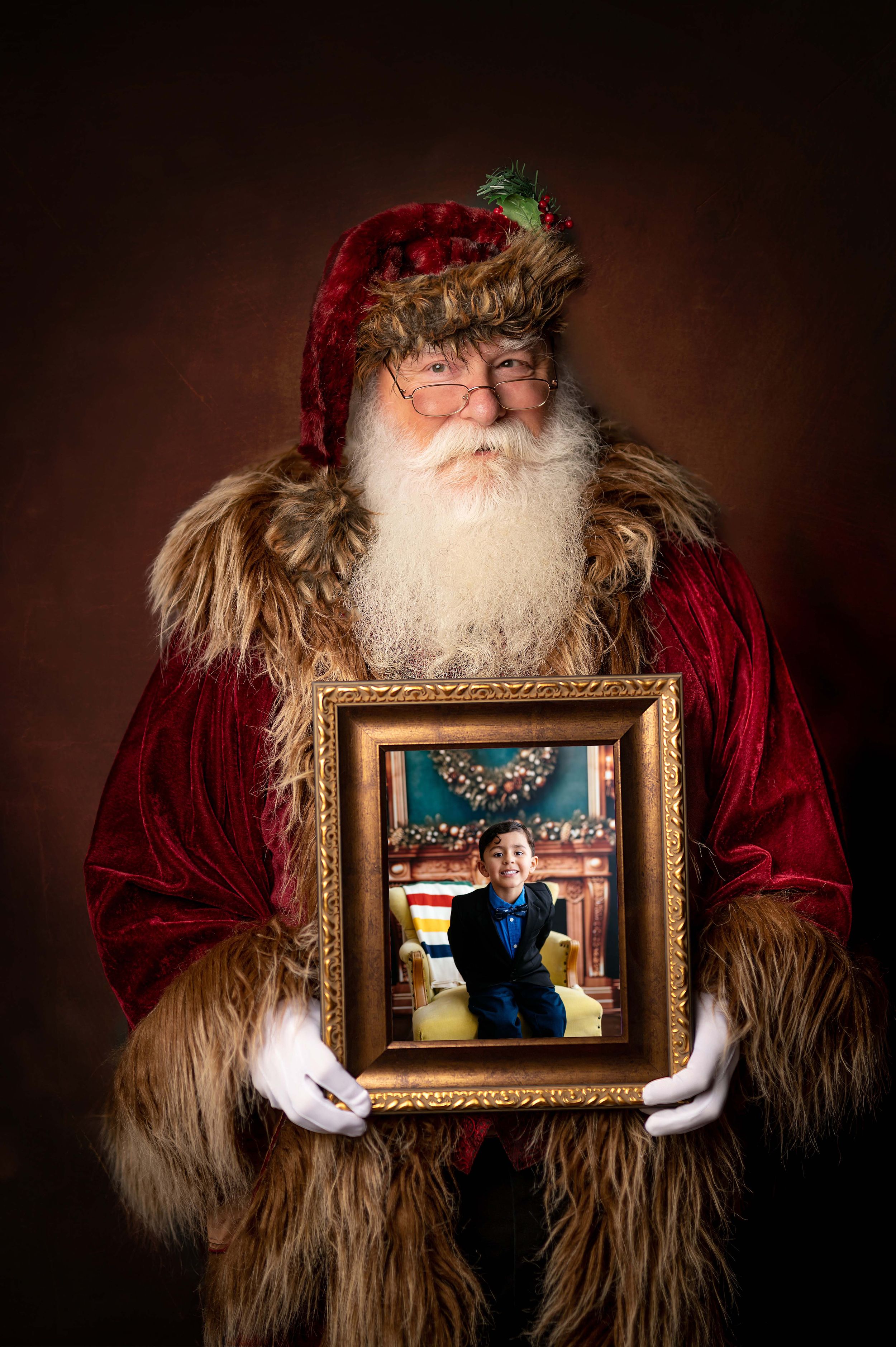 Traditional holiday portrait featuring ornate gold frame and velvet costume.