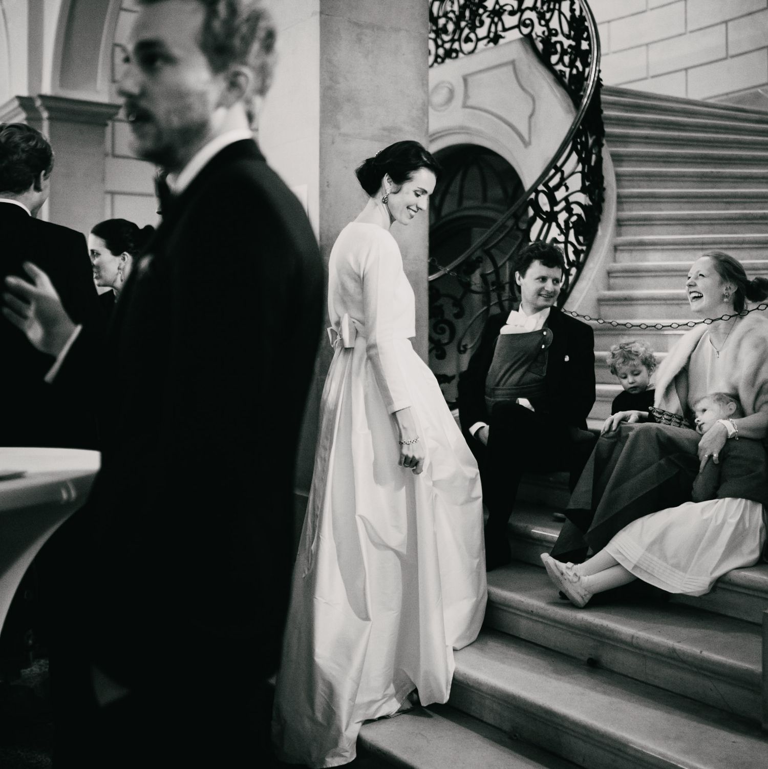 Vintage-style black and white wedding photography on stone steps.