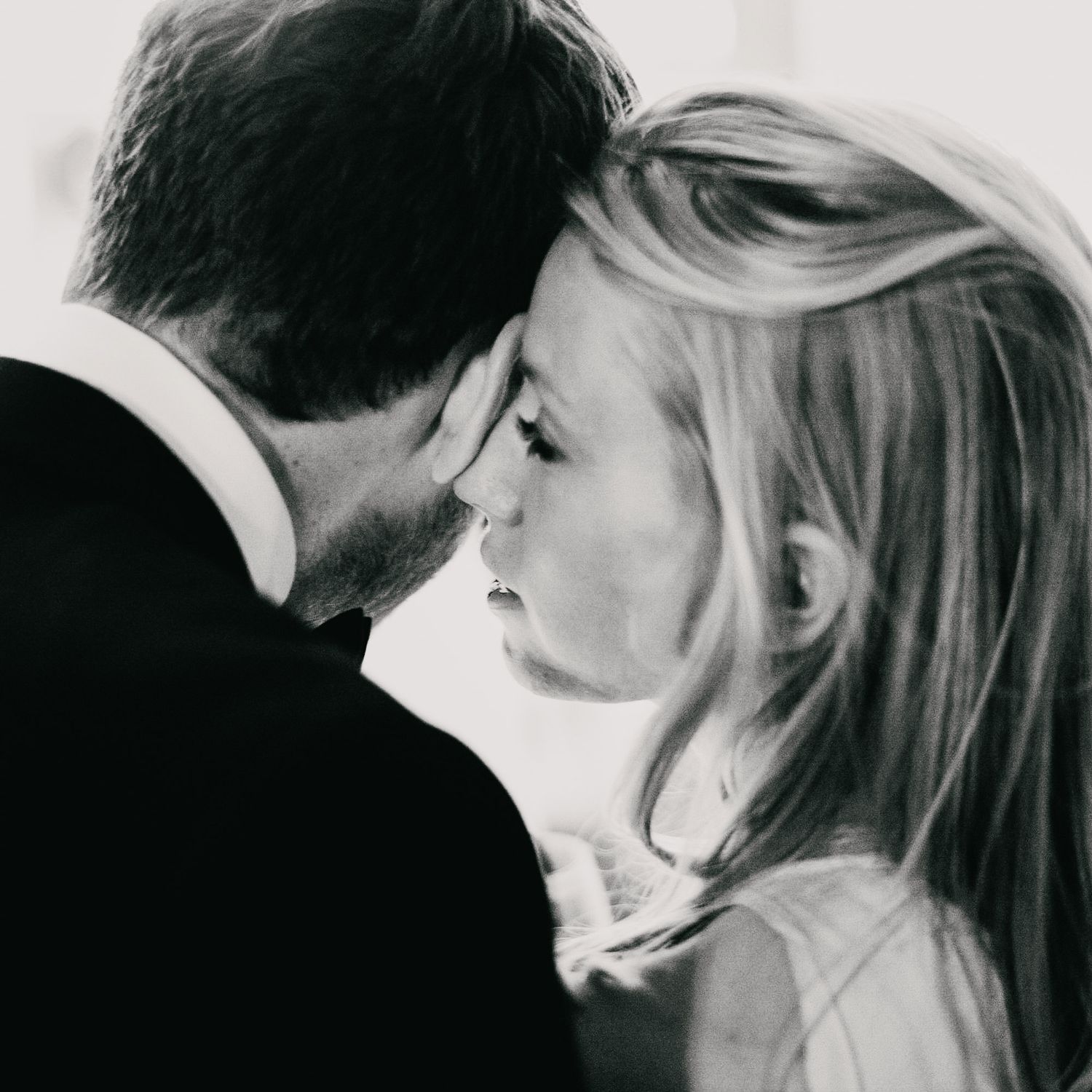 Intimate black and white close-up portrait of a romantic moment.