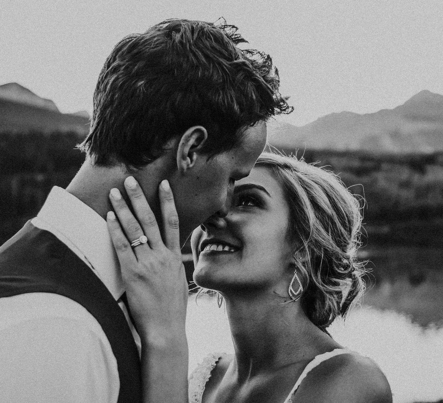 Black and white photo of bride looking at groom with love in Banff