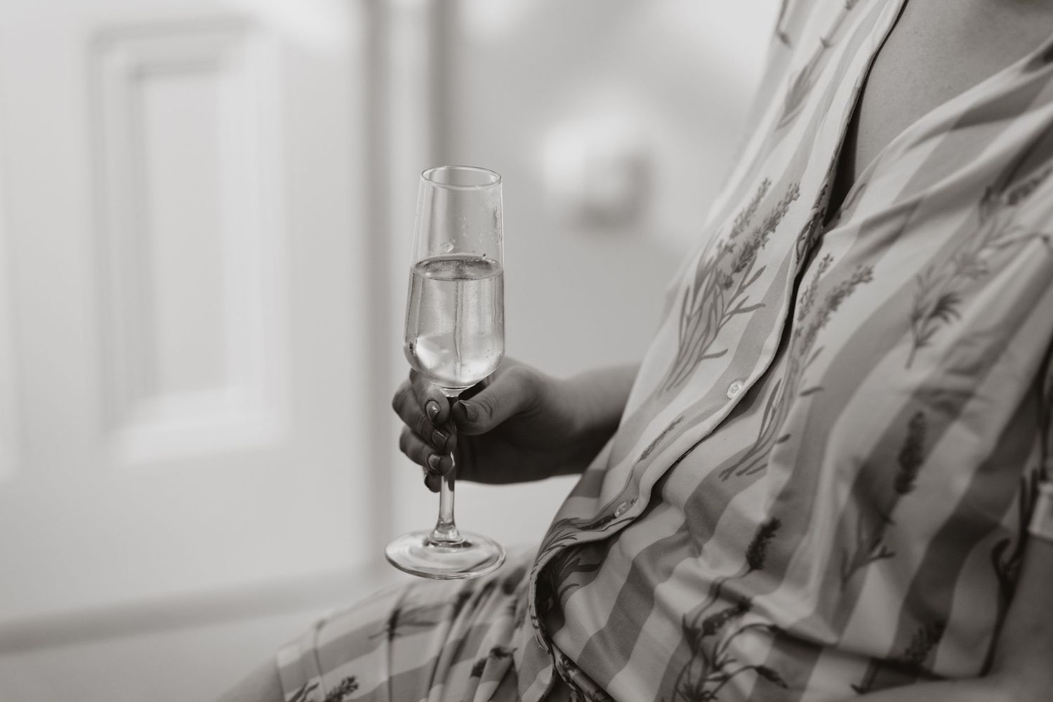 Detailed shot of champagne whilst bride gets ready on morning of wedding