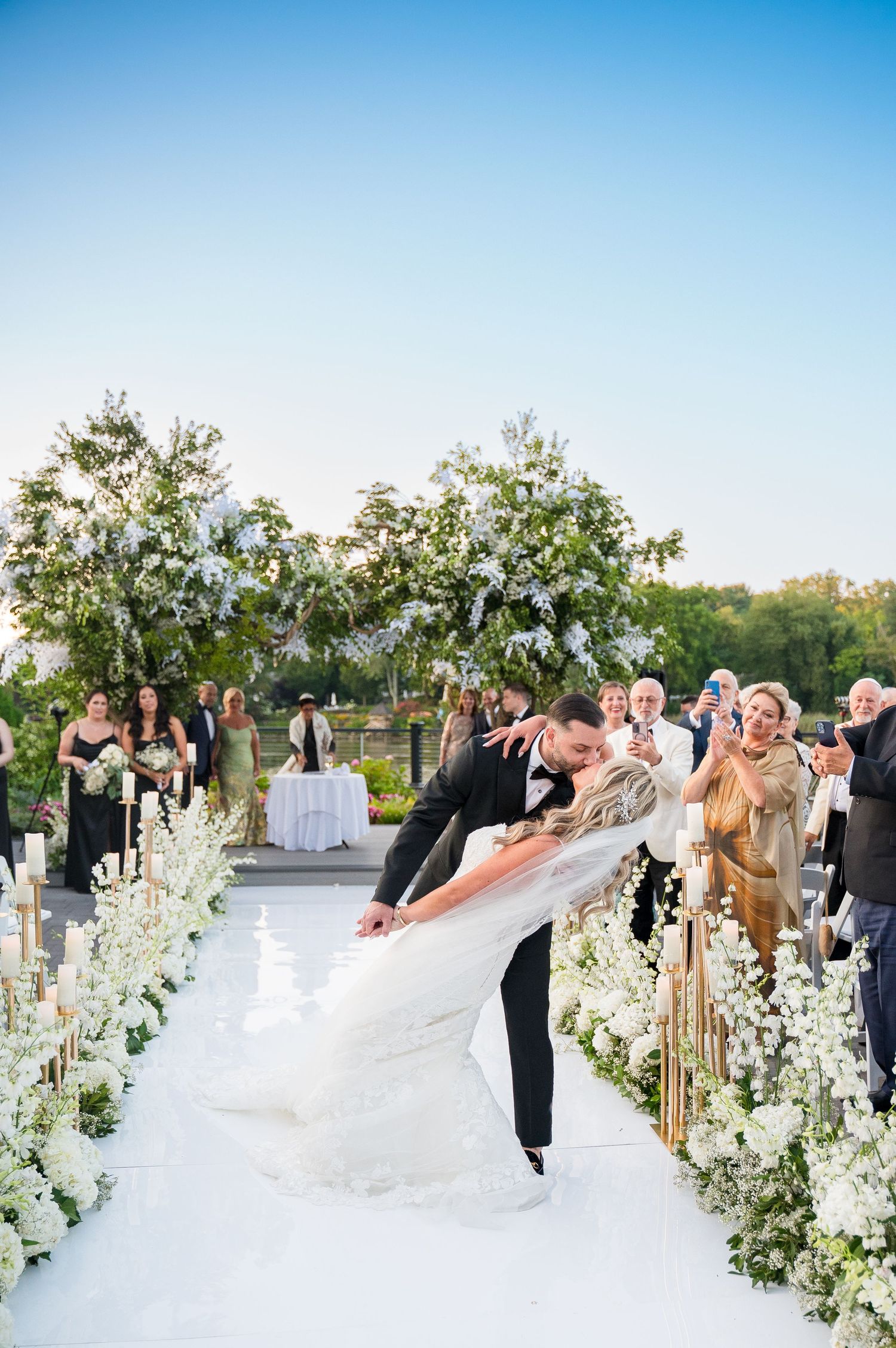 Groom dipping the bride as they exit the ceremony.