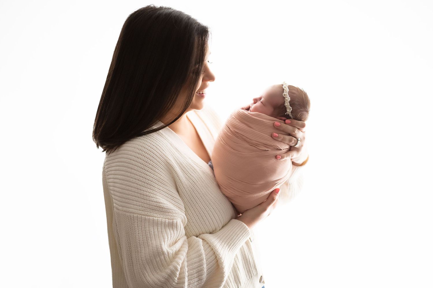Series of tender parental moments with baby against white background.