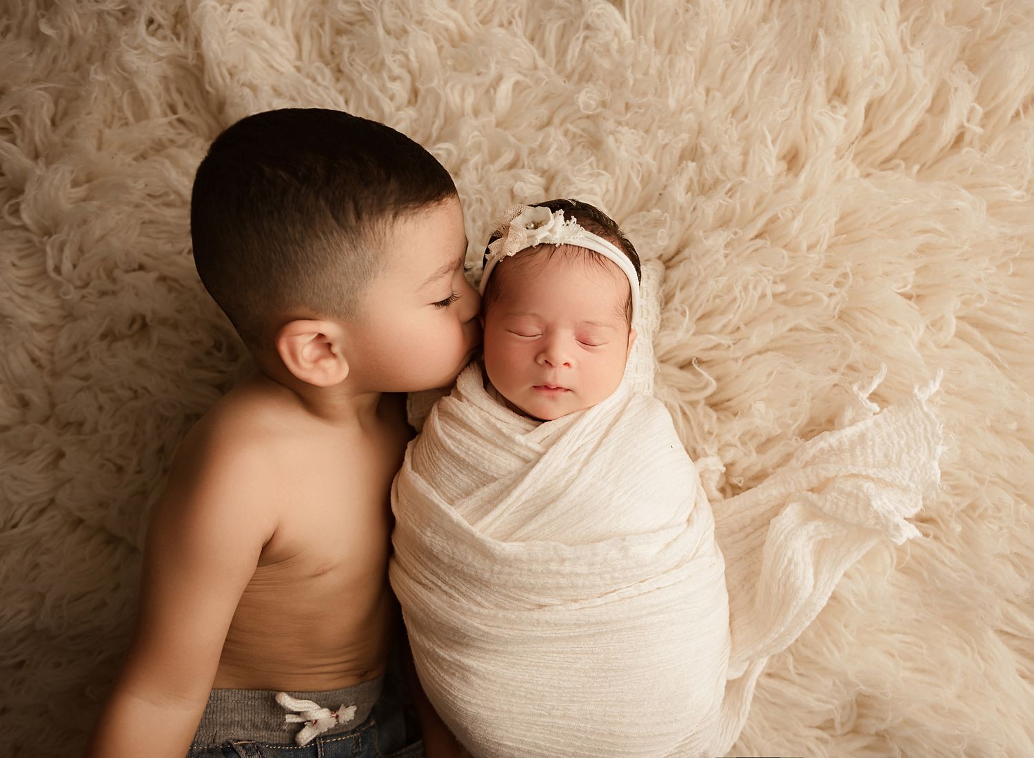 newborn photography session moreno valley california, brother kissing newborn sister