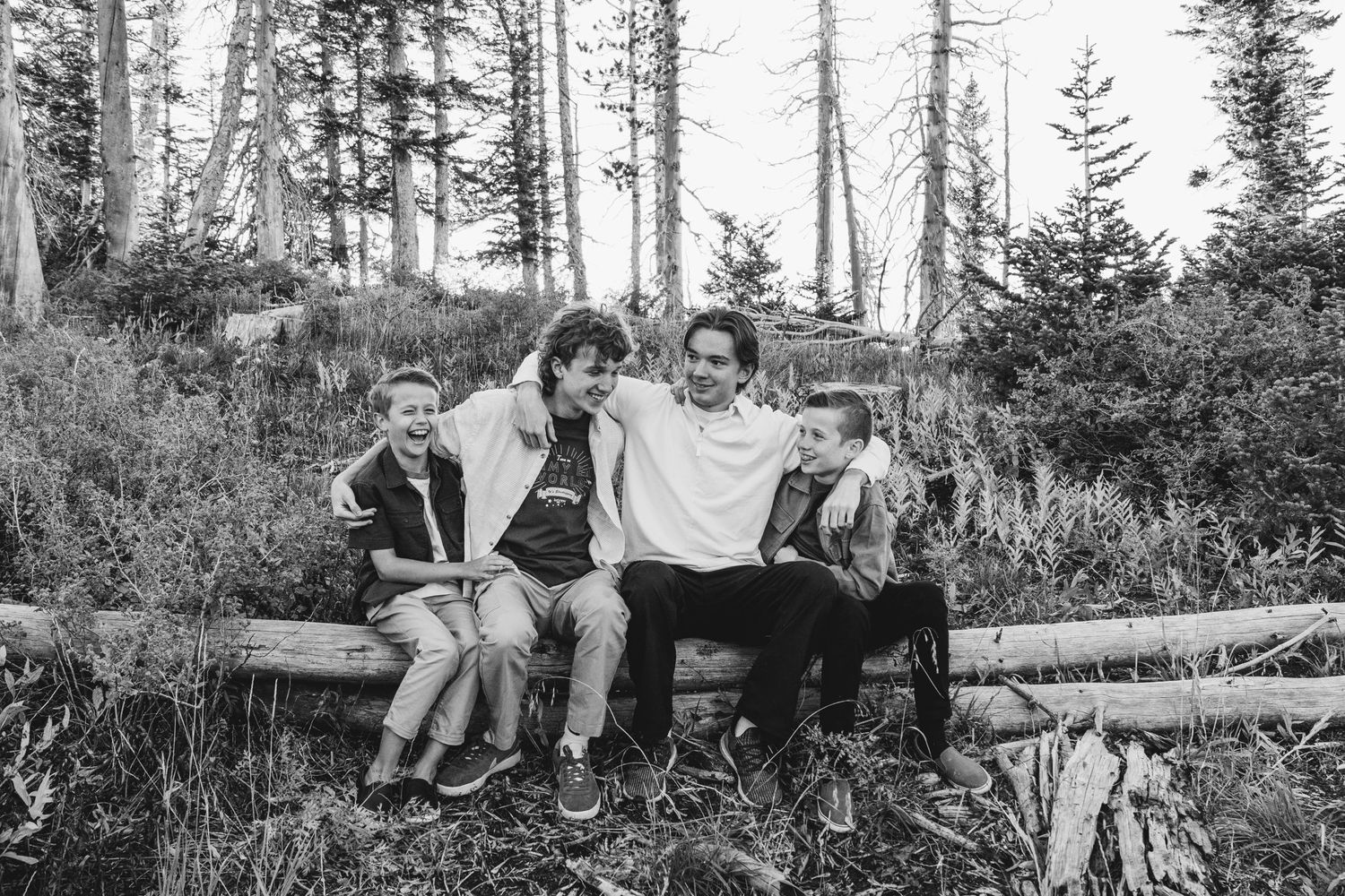 A warm and candid portrait of a couple/family, captured in natural light, with a timeless background.