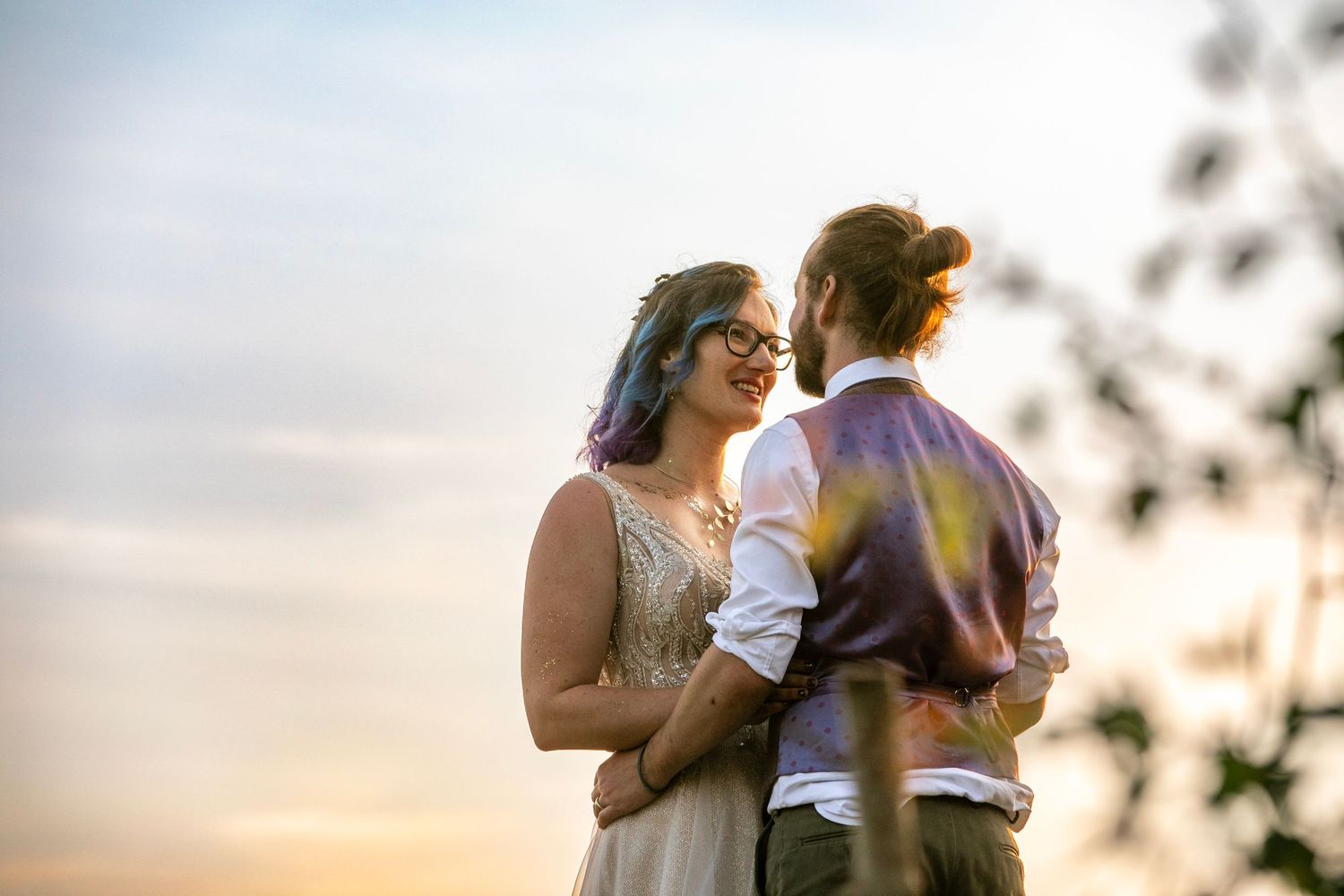 Intimate outdoor moments captured during golden hour sunset.