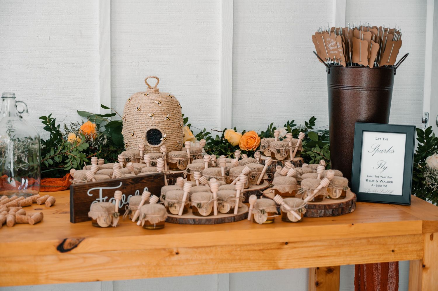 Rustic wooden display table with decorative birdhouse and natural elements.