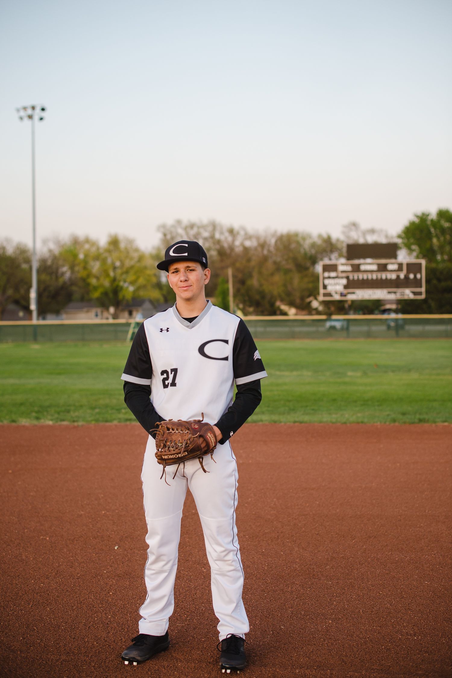 Campus Haysville high school senior pictures at baseball field - Derby, Wichita, KS photographer
