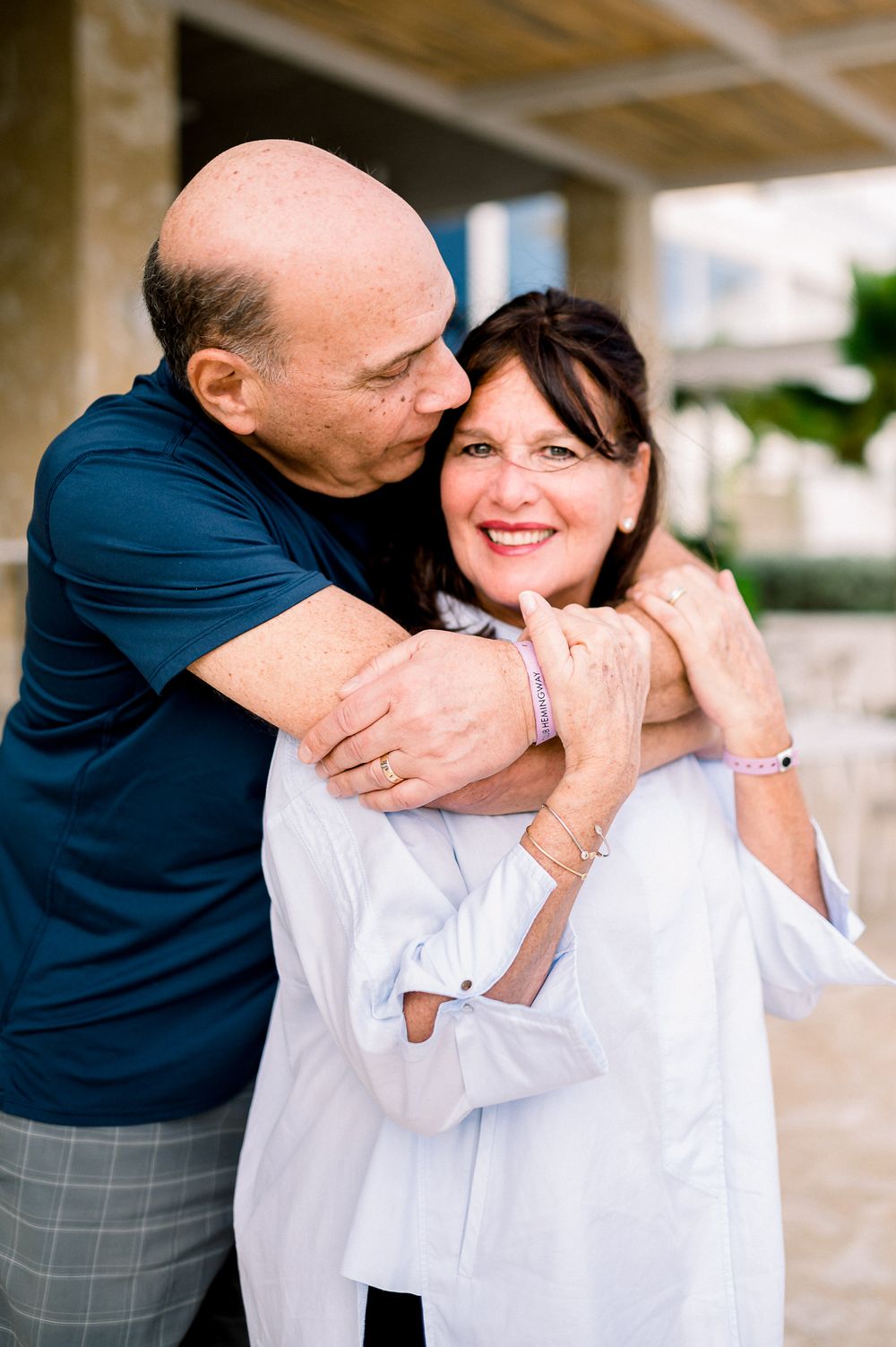 Affectionate couple sharing tender moment outdoors.