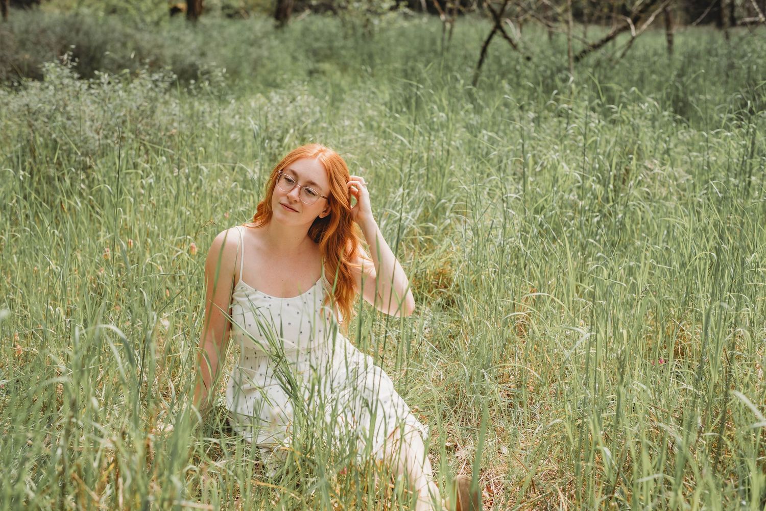 Ethereal outdoor photography in a sunlit meadow with flowing grass.