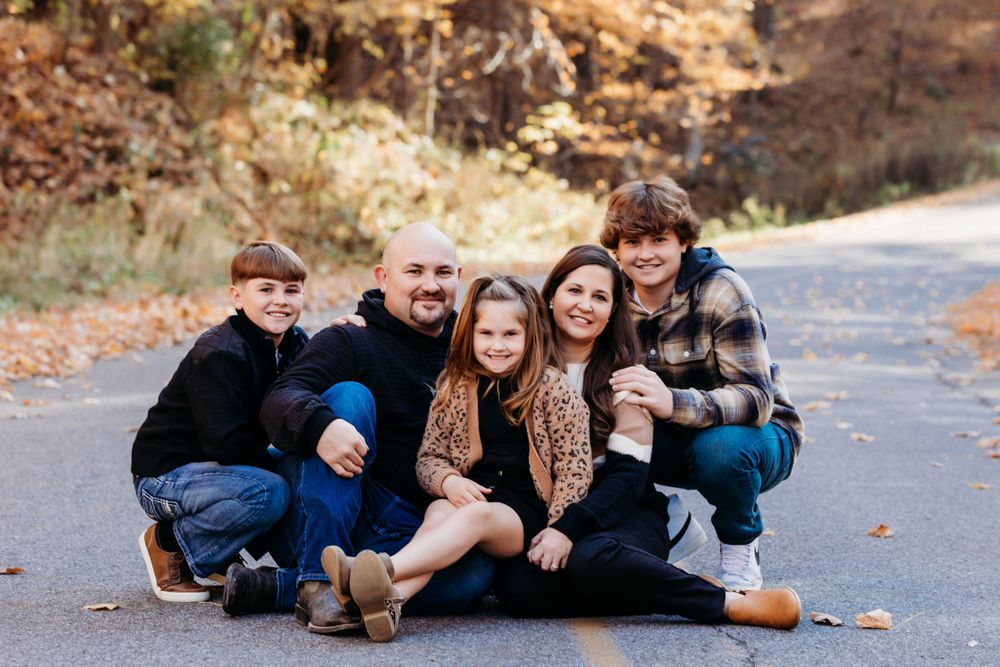 family photos in the Coralville Iowa fossil gorge couple sage and ivy studio Oxford Iowa corridor Iowa fall sunset warm