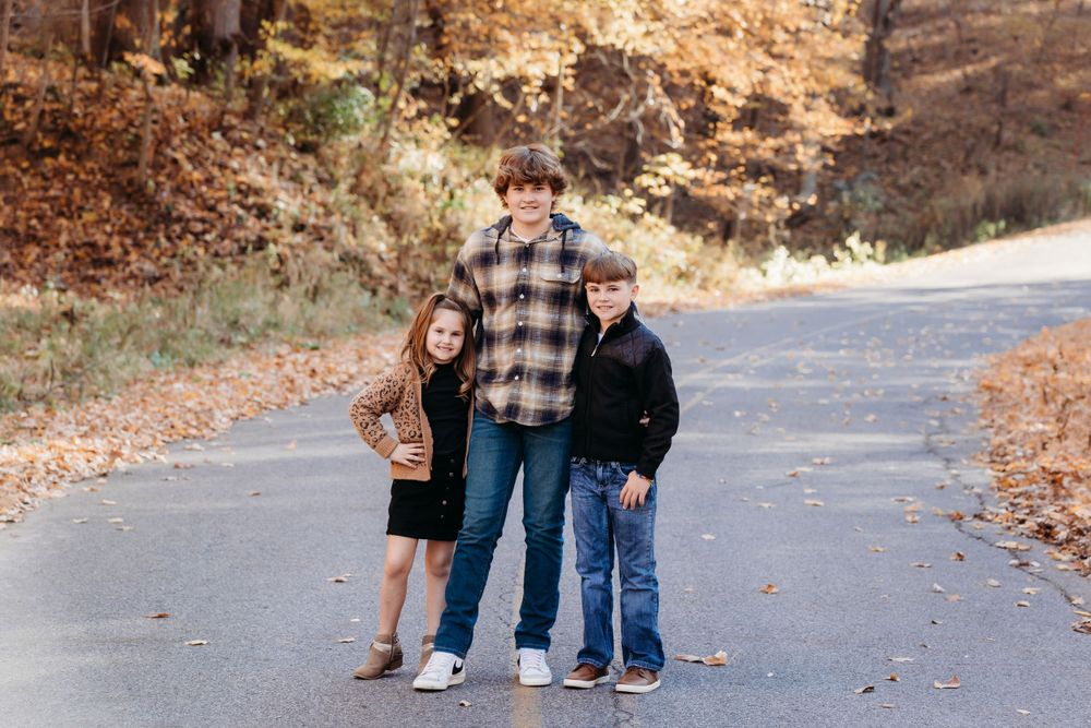 family photos in the Coralville Iowa fossil gorge couple sage and ivy studio Oxford Iowa corridor Iowa fall sunset warm