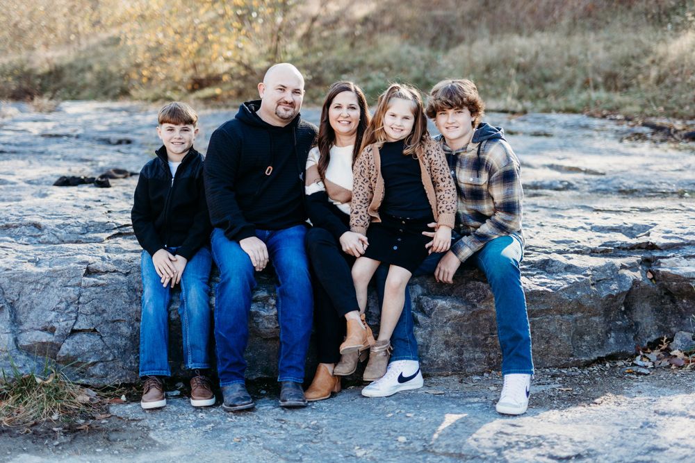 family photos in the Coralville Iowa fossil gorge couple sage and ivy studio Oxford Iowa corridor Iowa fall sunset warm