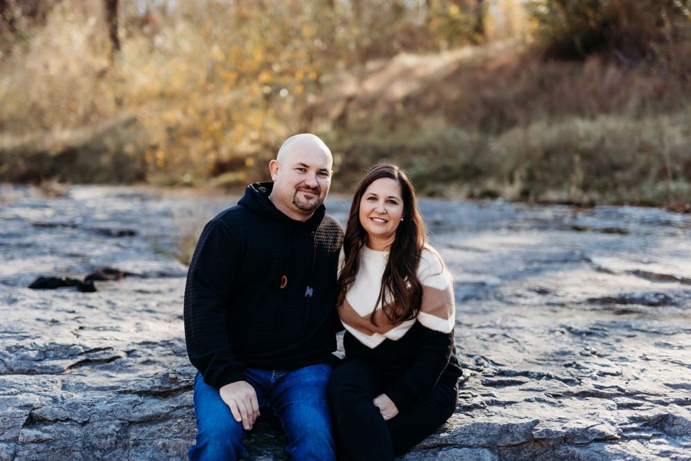 family photos in the Coralville Iowa fossil gorge couple sage and ivy studio Oxford Iowa corridor Iowa fall sunset warm
