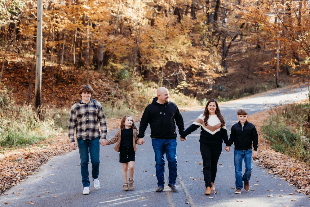 family photos in the Coralville Iowa fossil gorge couple sage and ivy studio Oxford Iowa corridor Iowa fall sunset warm