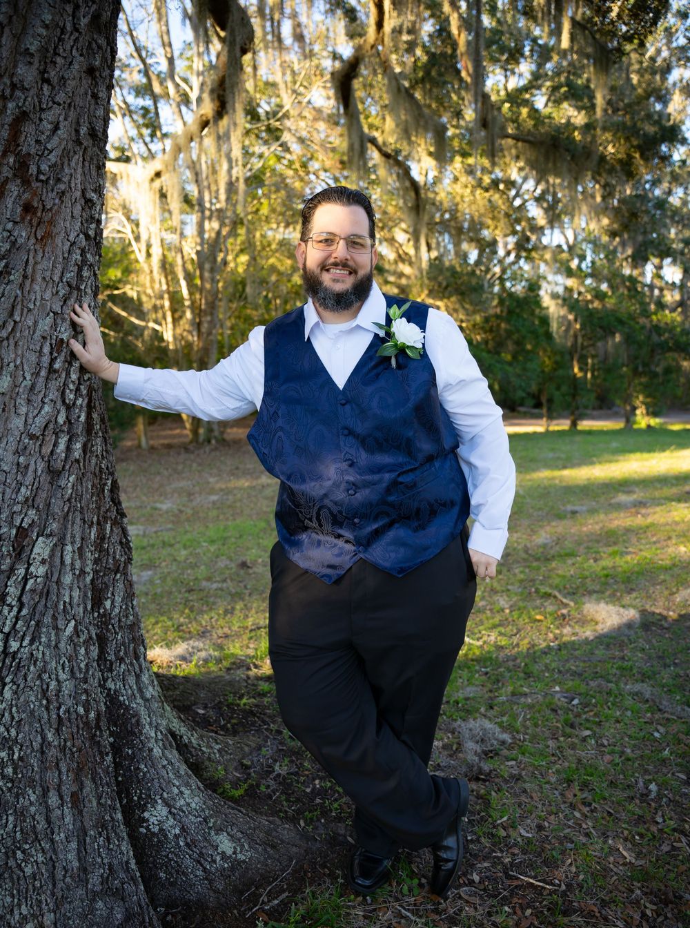 Wedding photography sequence showing playful poses against a tree in natural lighting.