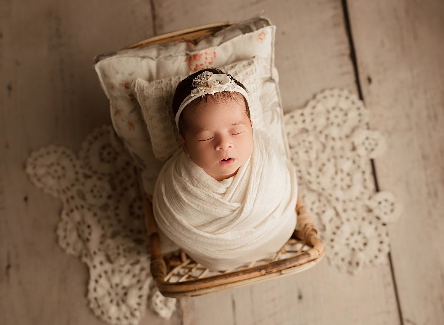 professional newborn photography moreno valley california, baby girl asleep on miniature bed