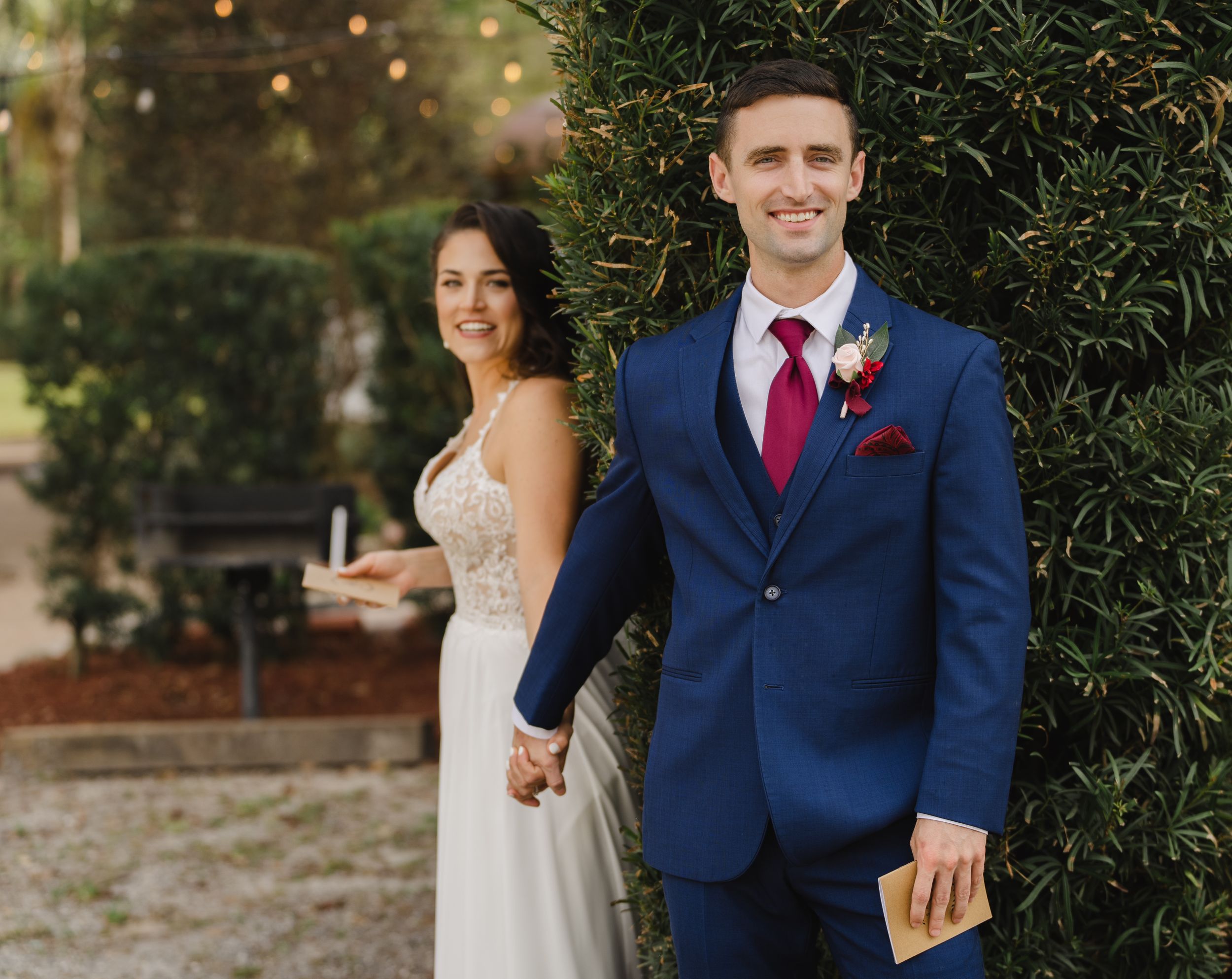 bride & groom hold hands outdoors during first touch before reading their vows
