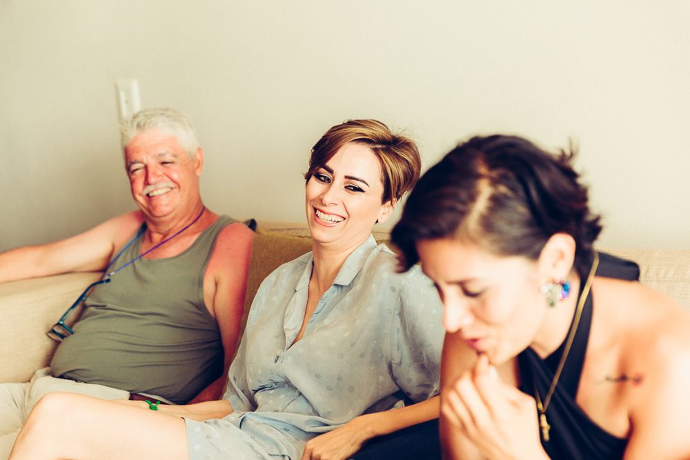 Candid moment of relaxation during wedding preparations.