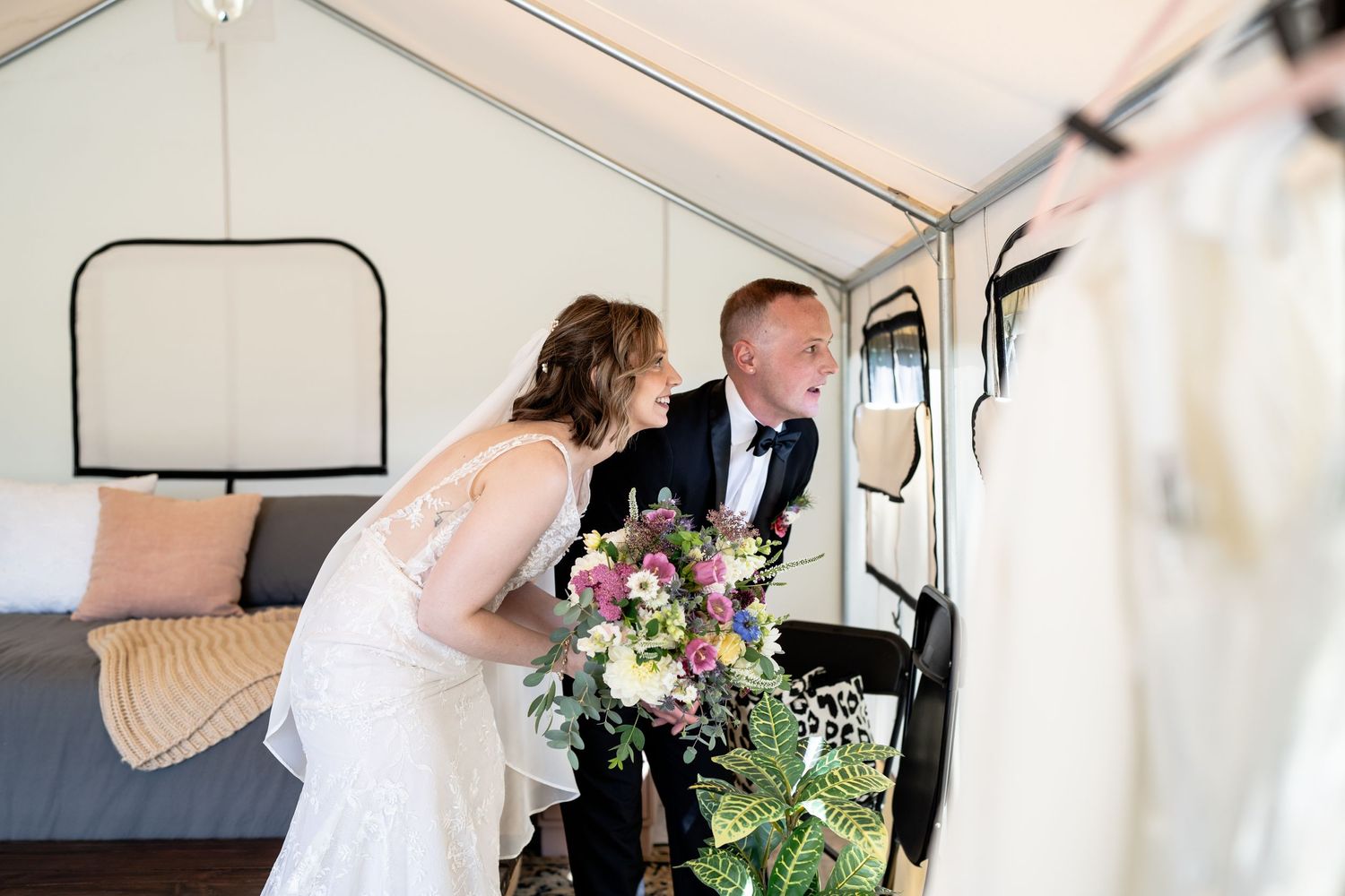 A candid moment inside a vintage van with wedding bouquet and bridal details.