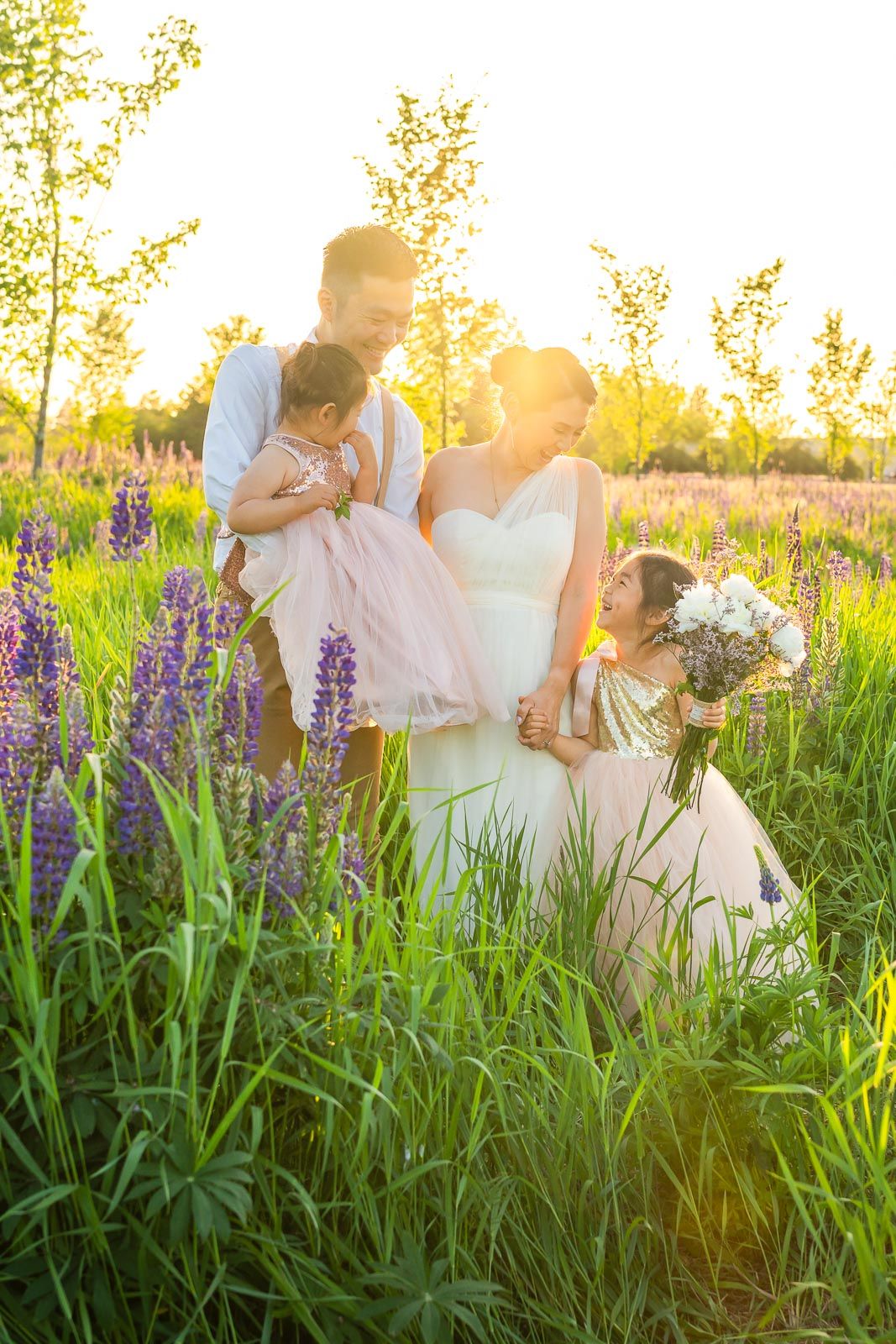 Family laughing together at golden hour at Van Lierop Park in Puyallup.
