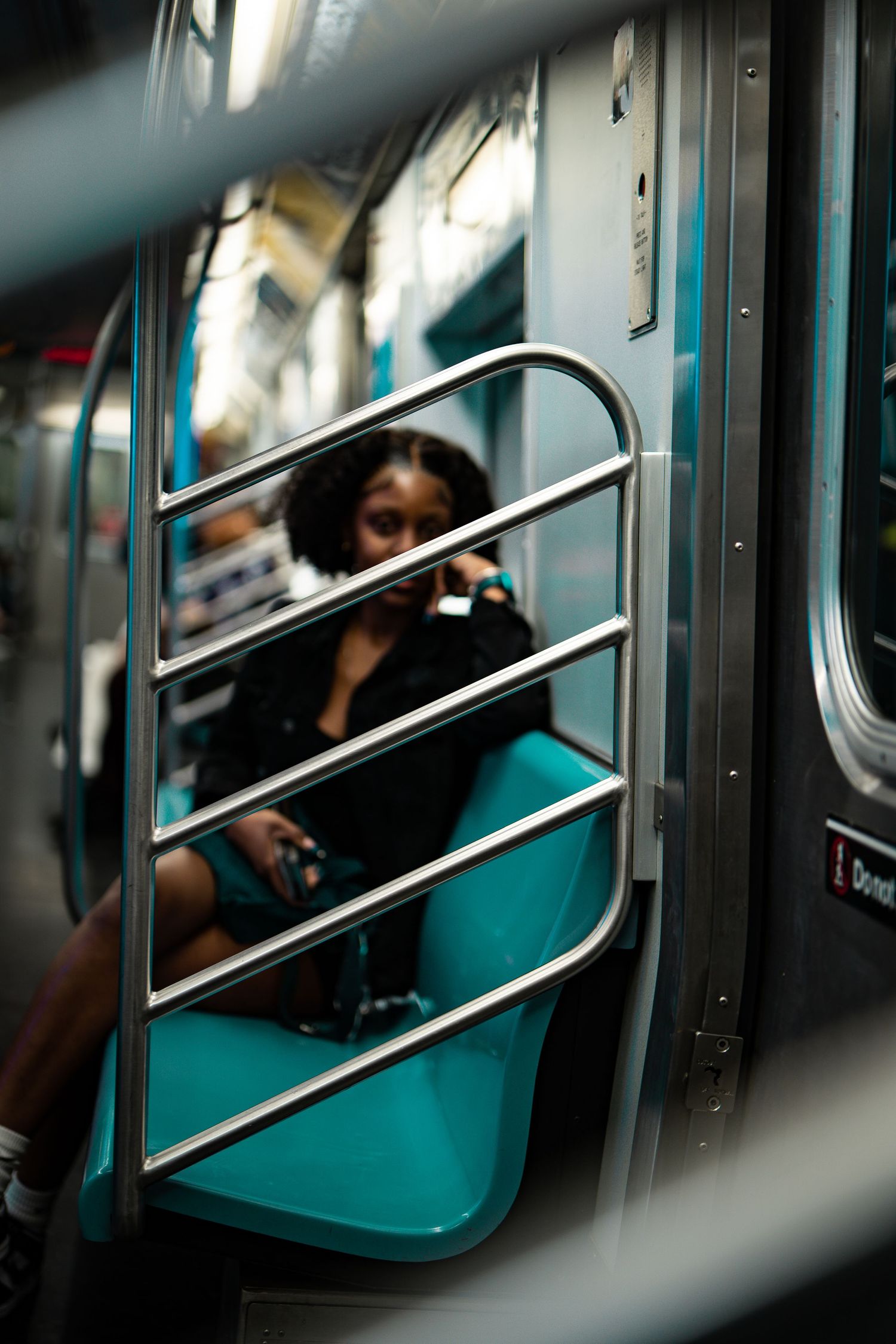 Woman on train in New York - Timoy B Photography