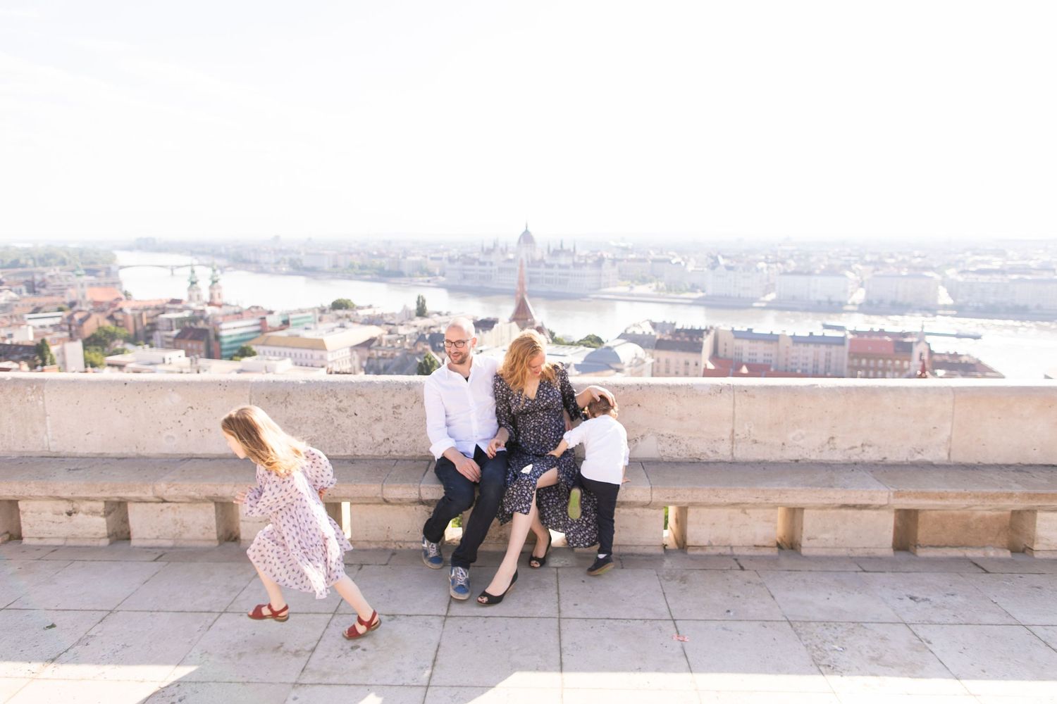 Family photoshoot at Fisherman’s Bastion in Budapest with scenic architecture, natural light, and joyful candid moments.