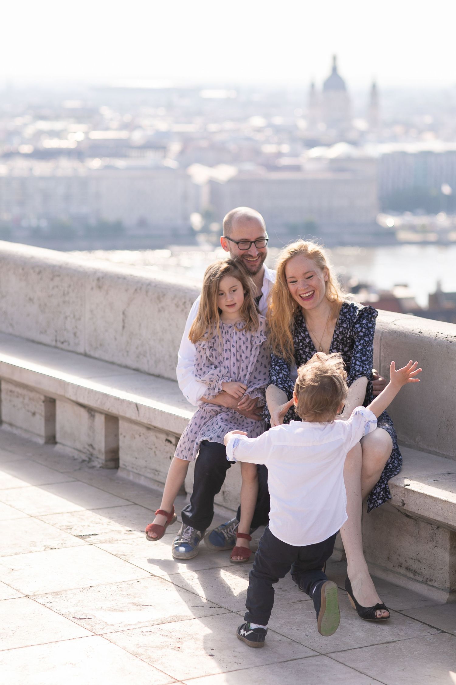 Family photoshoot at Fisherman’s Bastion in Budapest with scenic architecture, natural light, and joyful candid moments.