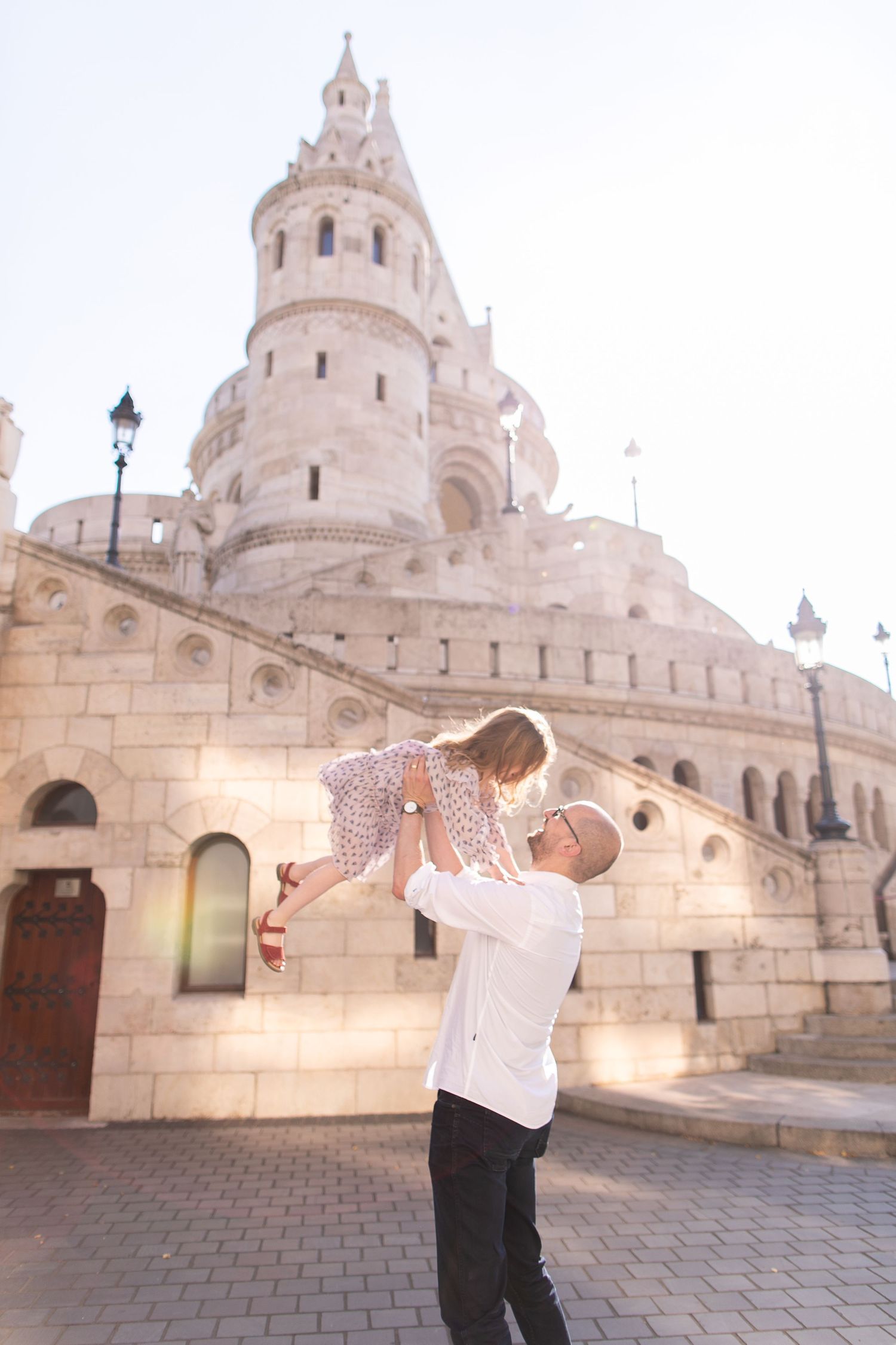 Family photoshoot at Fisherman’s Bastion in Budapest with scenic architecture, natural light, and joyful candid moments.