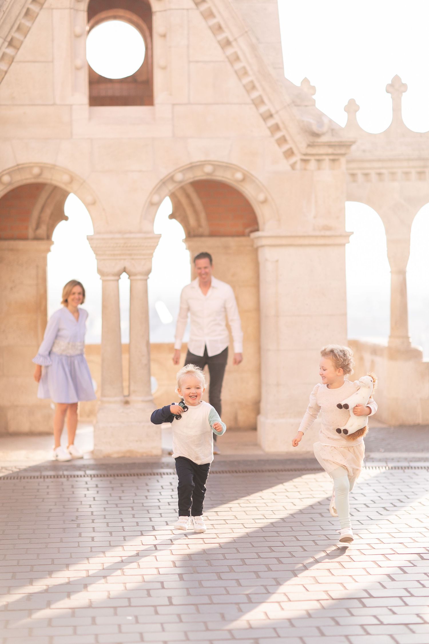 Family photoshoot at Fisherman’s Bastion in Budapest with scenic architecture, natural light, and joyful candid moments.