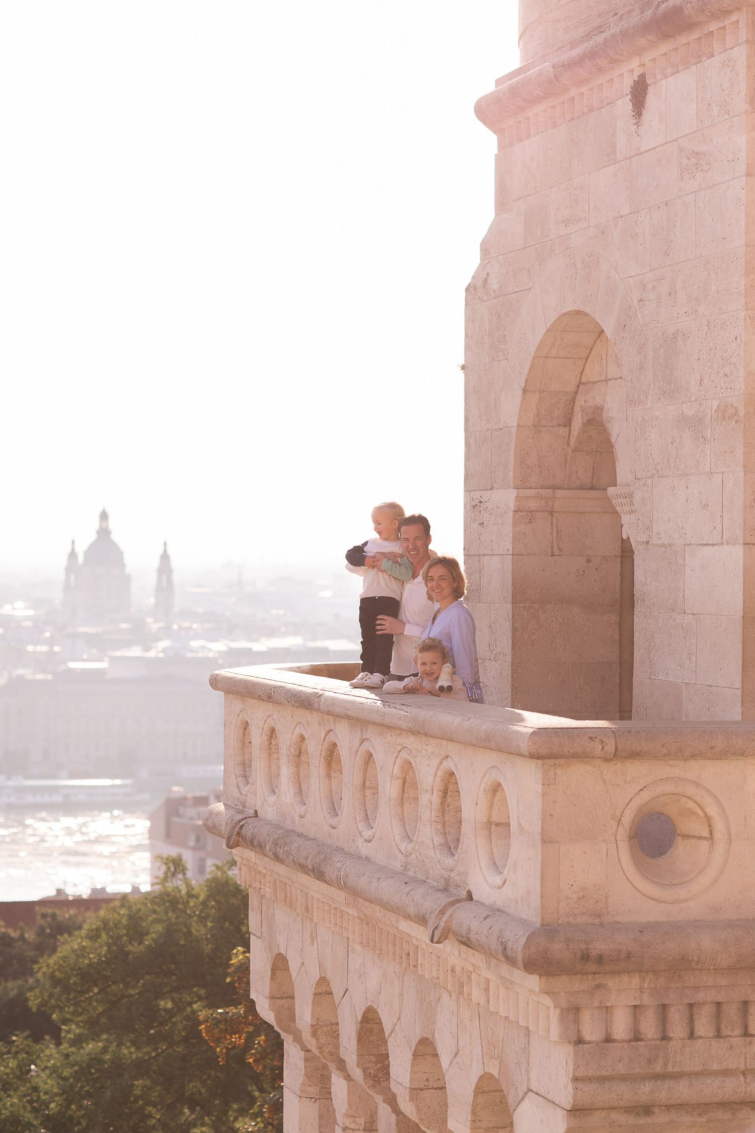 Family photoshoot at Fisherman’s Bastion in Budapest with scenic architecture, natural light, and joyful candid moments.