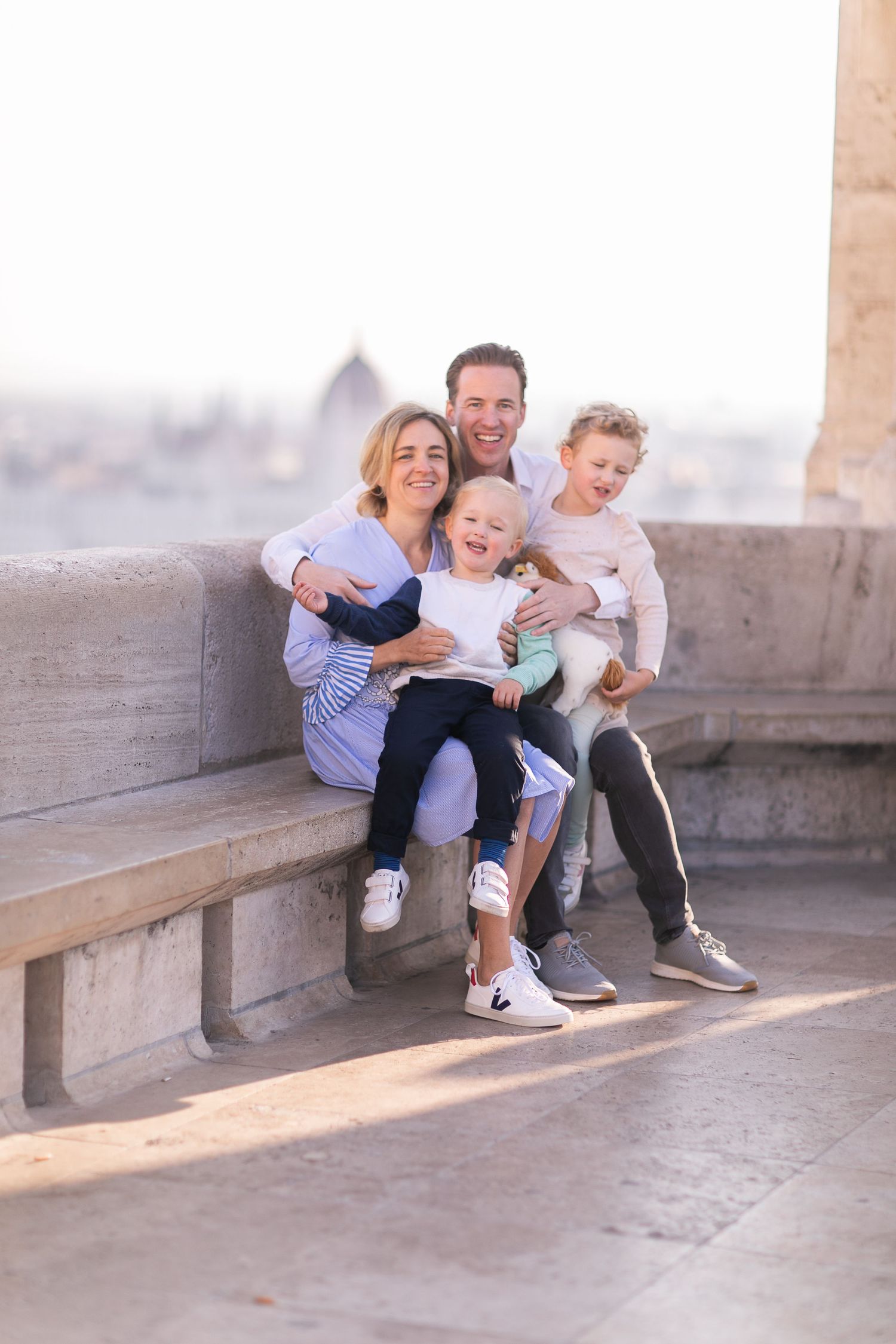 Family photoshoot at Fisherman’s Bastion in Budapest with scenic architecture, natural light, and joyful candid moments.
