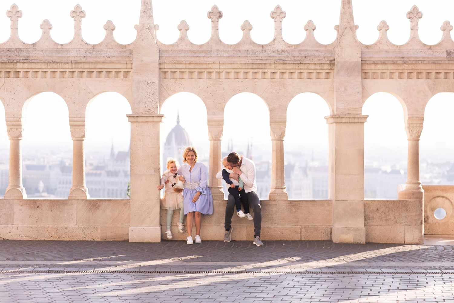 Family photoshoot at Fisherman’s Bastion in Budapest with scenic architecture, natural light, and joyful candid moments.