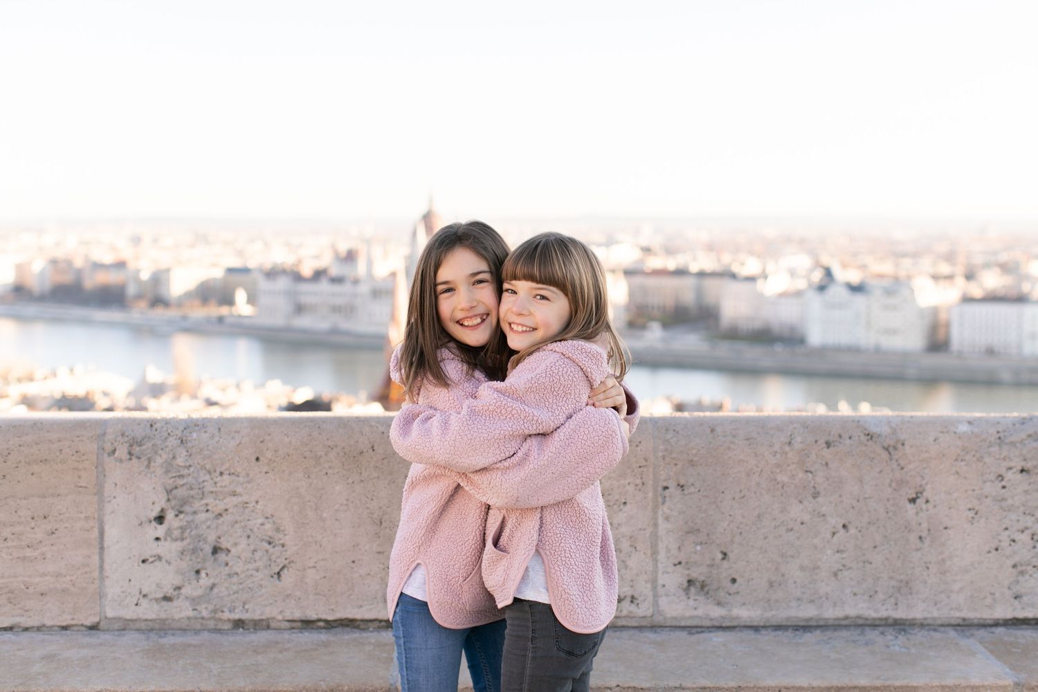 Family photoshoot at Fisherman’s Bastion in Budapest with scenic architecture, natural light, and joyful candid moments.