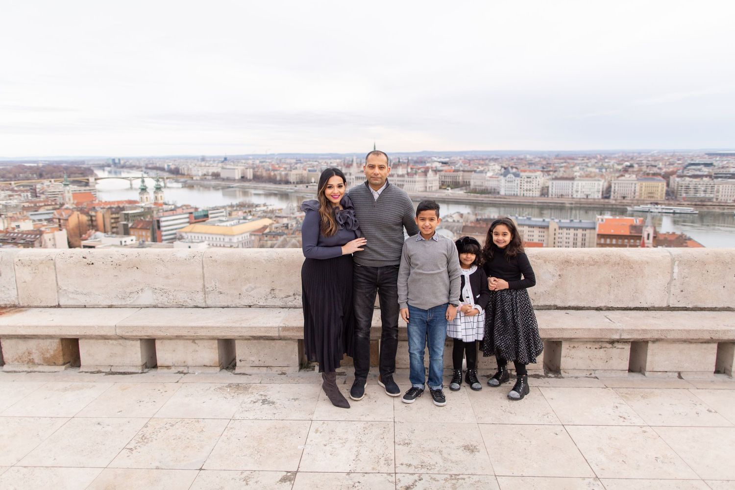 Family photoshoot at Fisherman’s Bastion in Budapest with scenic architecture, natural light, and joyful candid moments.