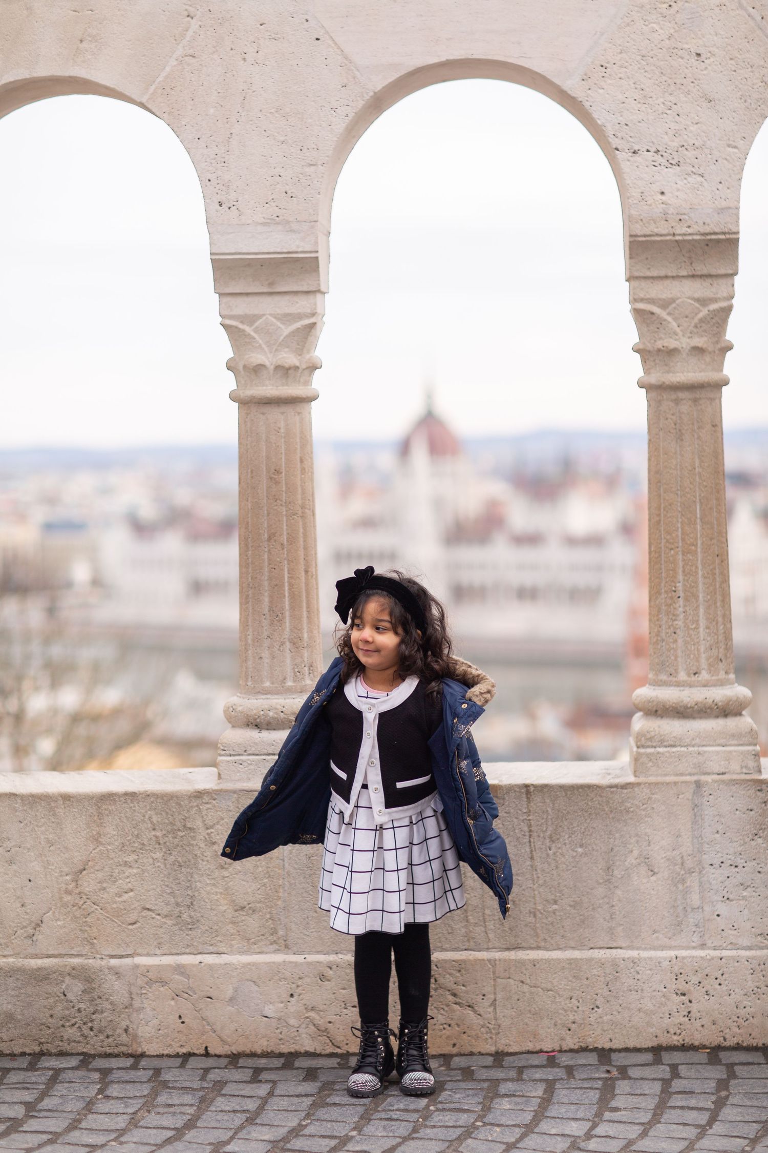 Family photoshoot at Fisherman’s Bastion in Budapest with scenic architecture, natural light, and joyful candid moments.
