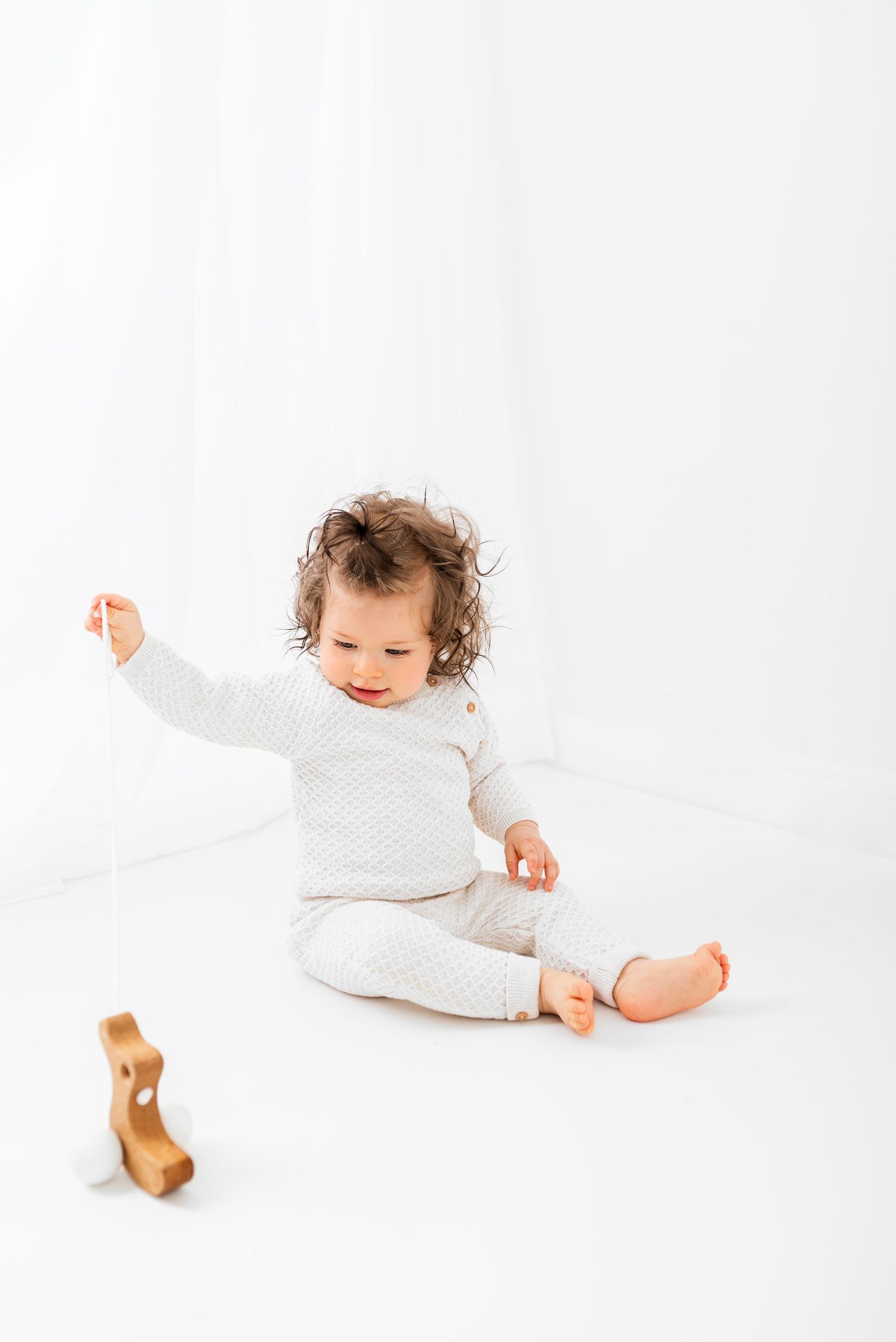 all white baby photos sitter