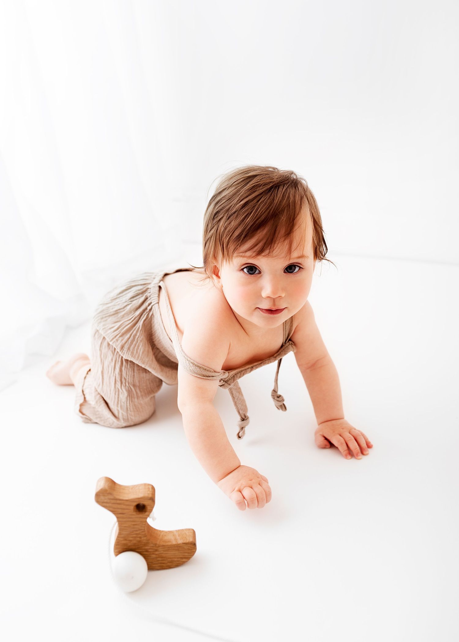 all white baby photos baby dungarees big window and curtain