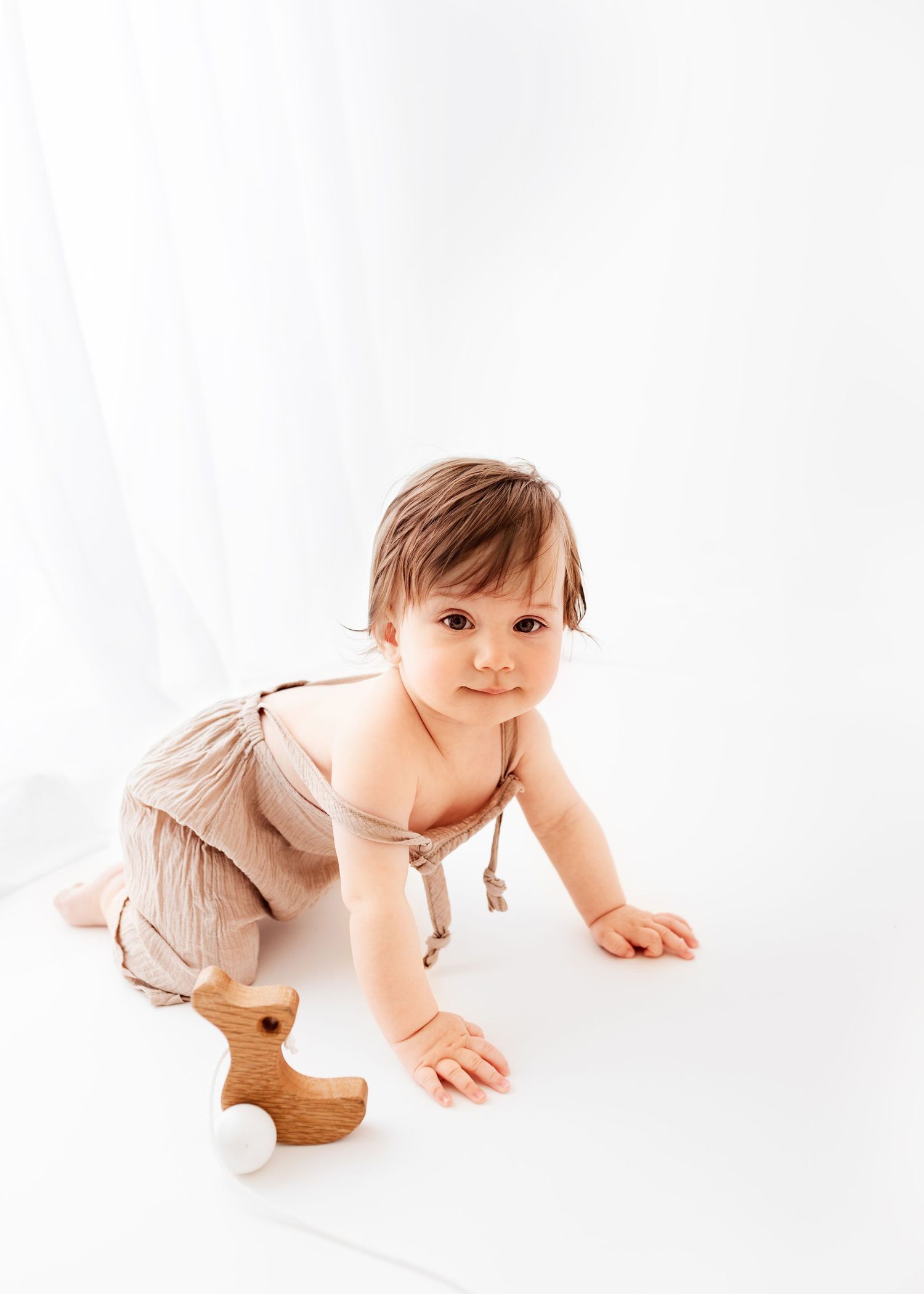 all white baby photos baby dungarees big window and curtain