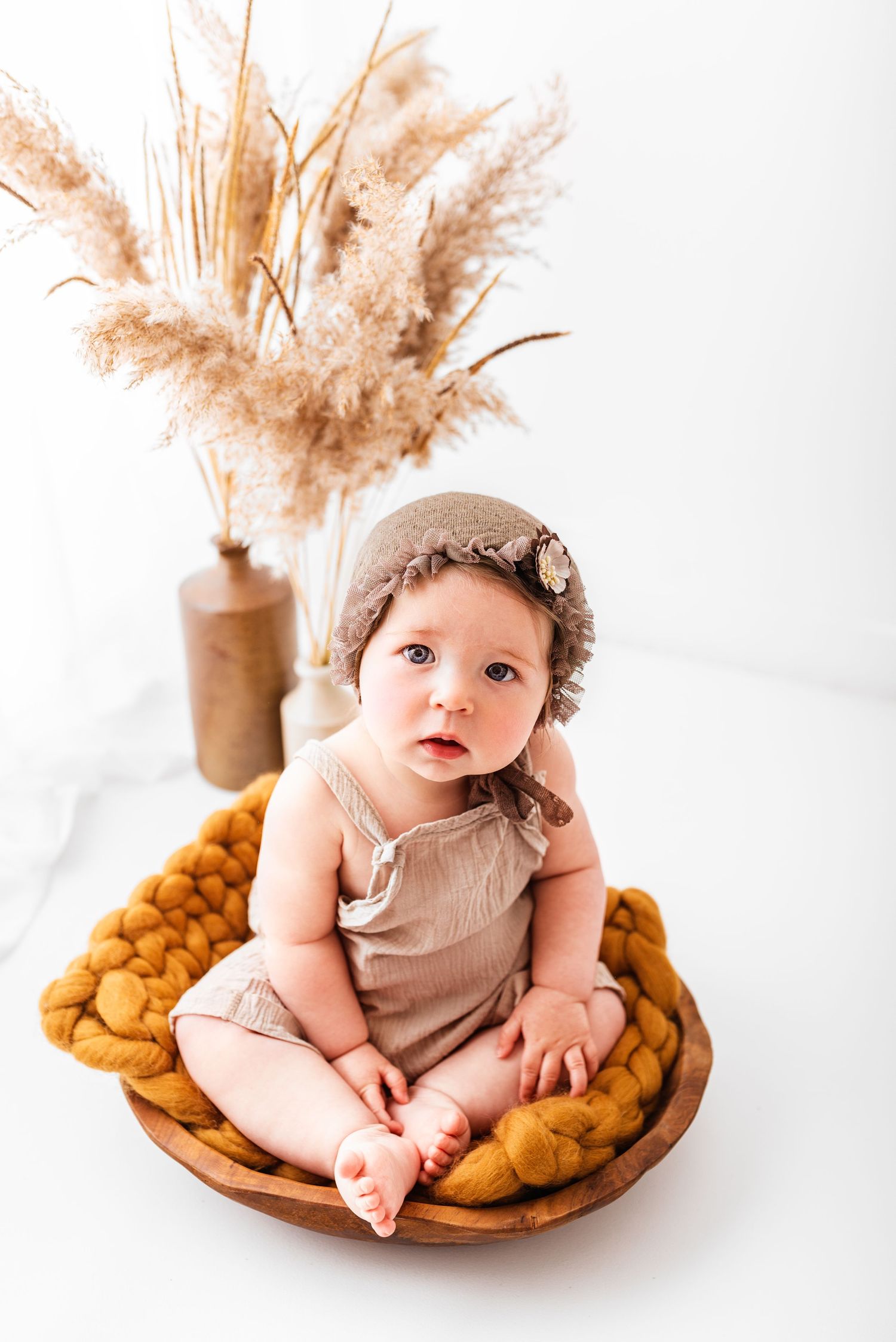 sitter session baby photo on white background boho style