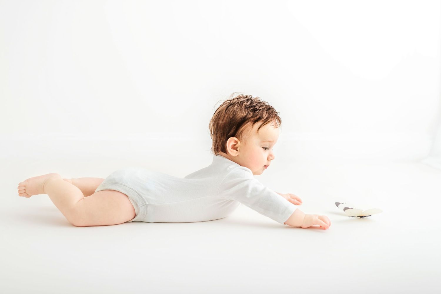 baby photo all white background baby with a butterfly