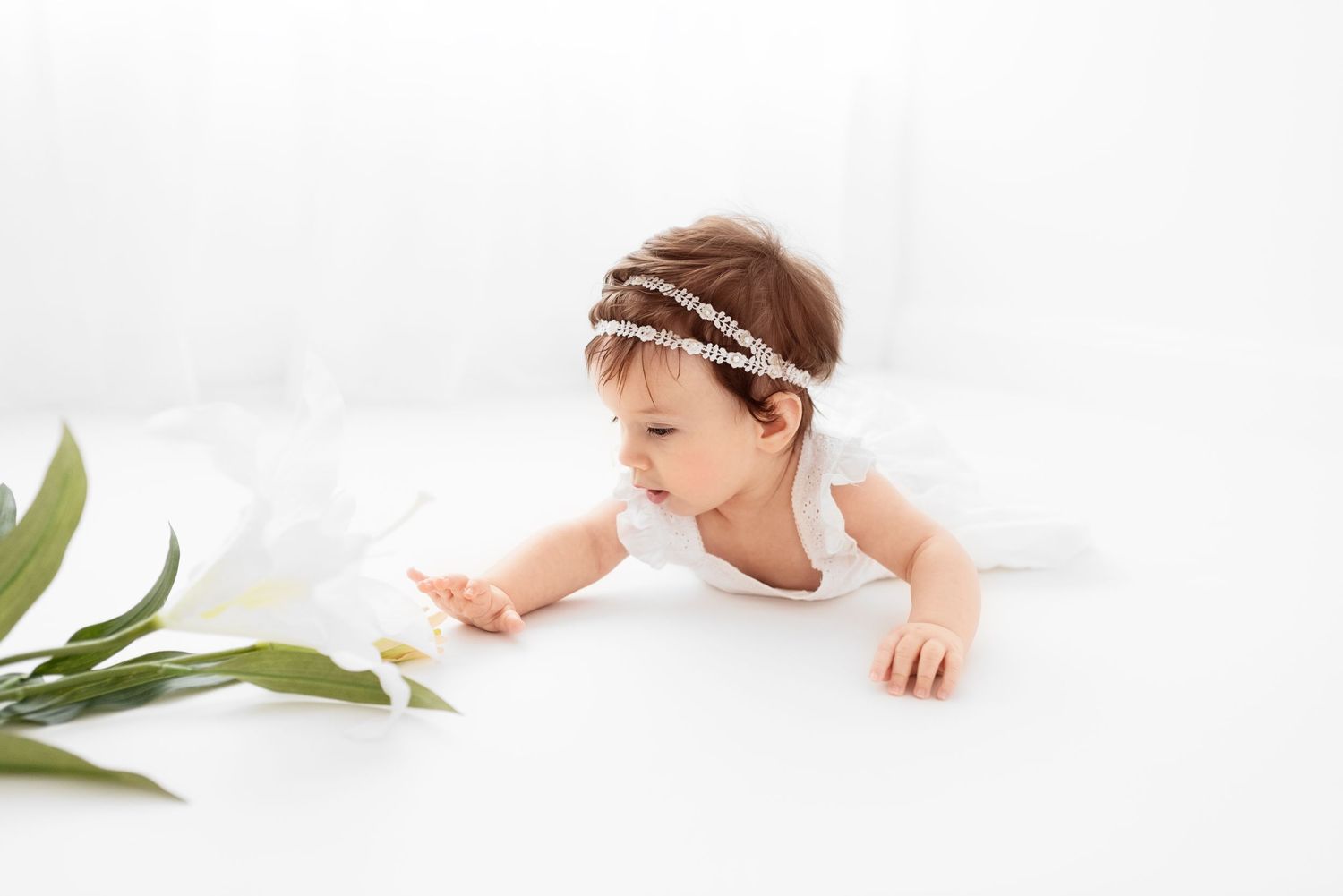 baby photo all white background baby milestone girl with a lily