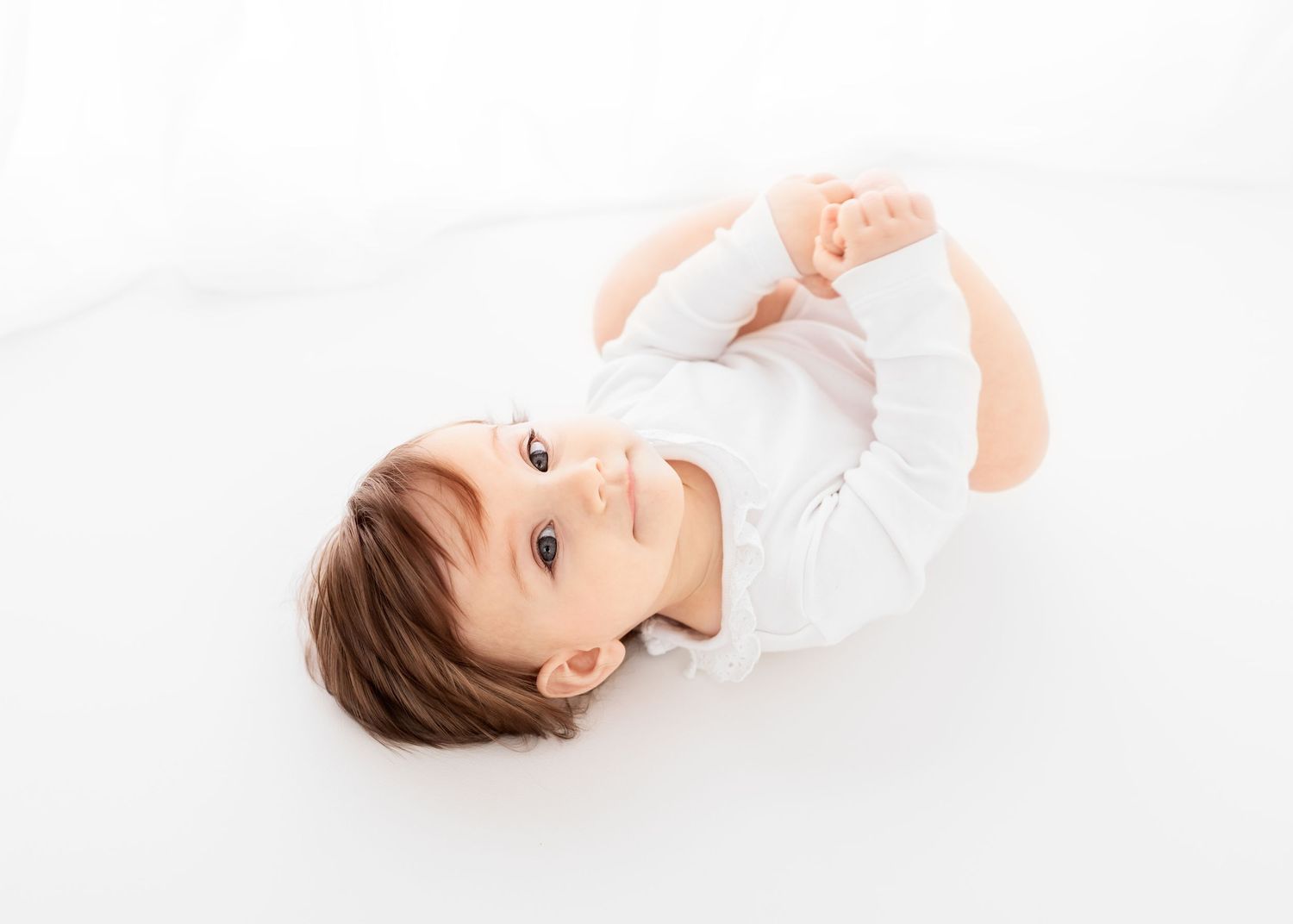 baby photo on white background in front of the window