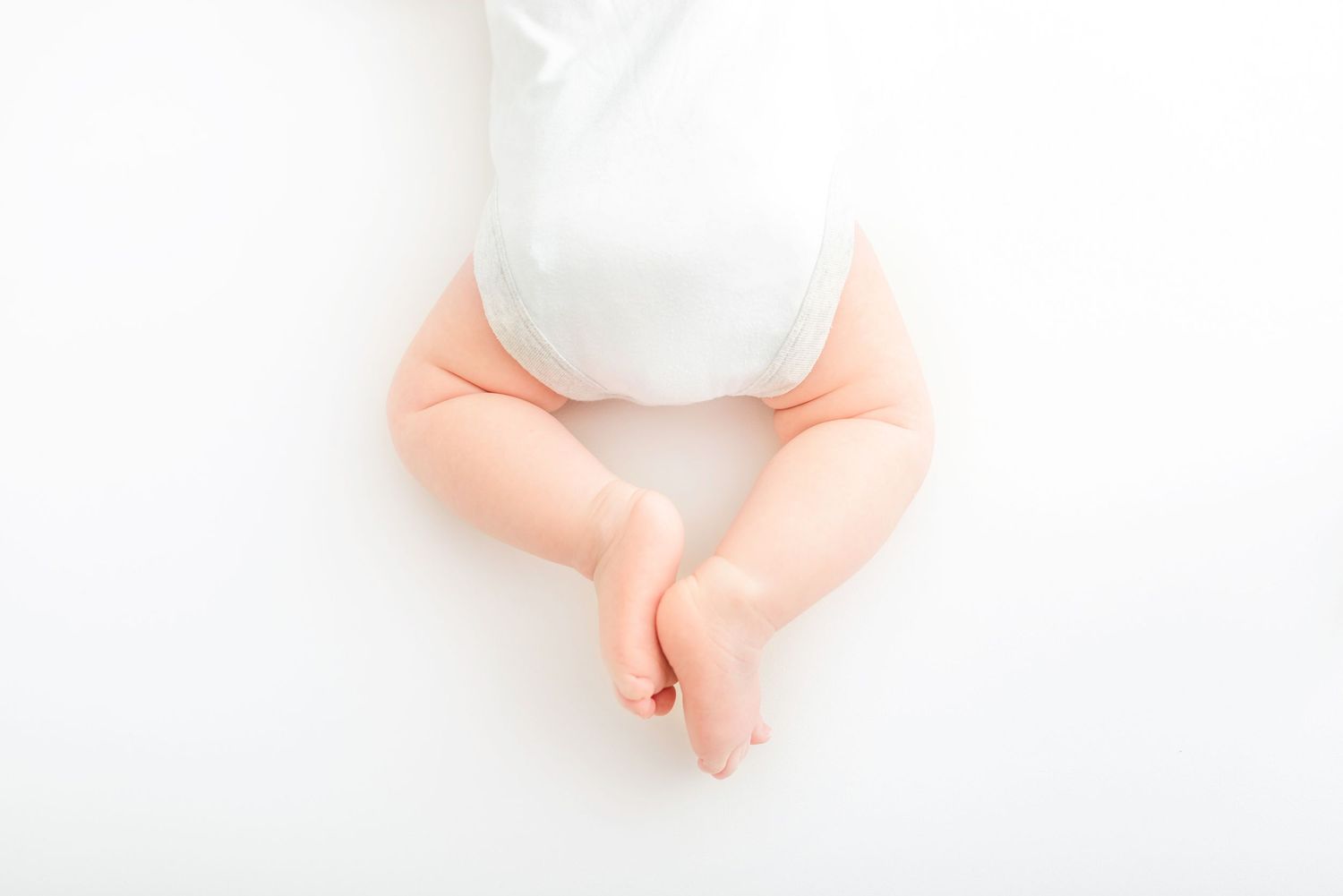 baby photo all white background detail shot of tiny feet