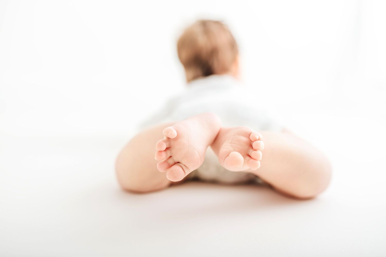 baby photo all white background tiny feet